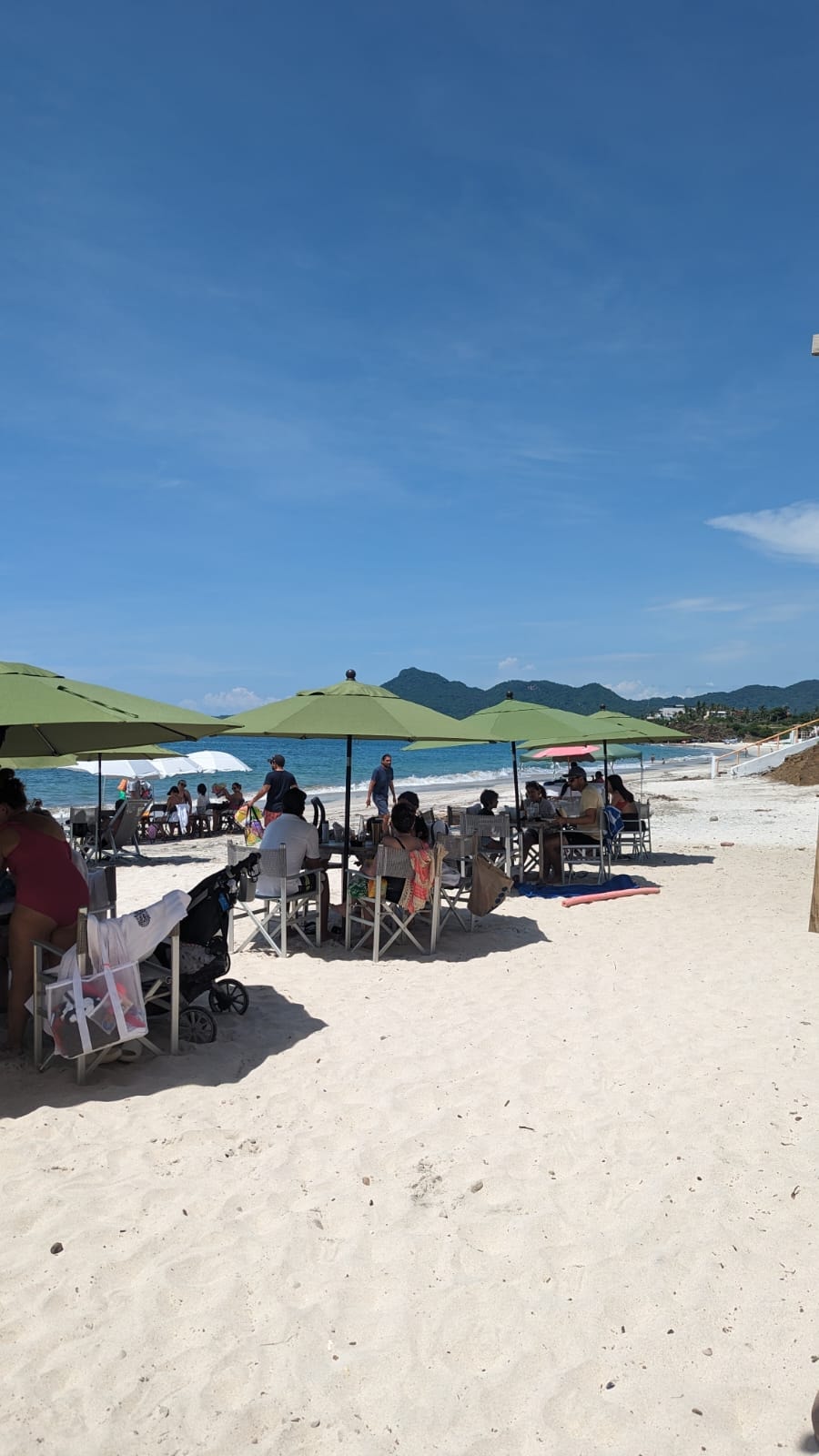 A dining area on the beach during the daytime