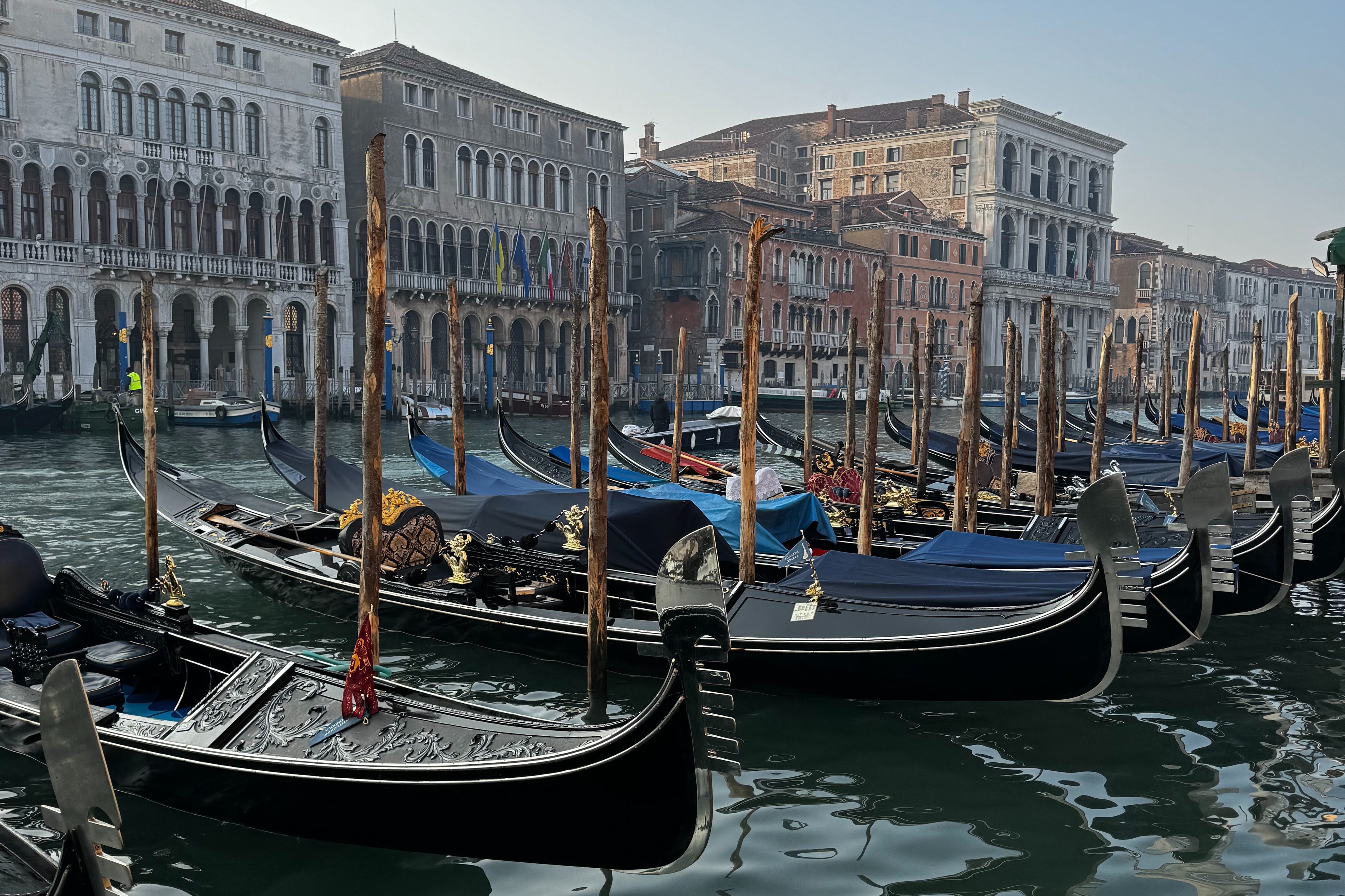 Row of gondolas at the Grand Canal, Venice.