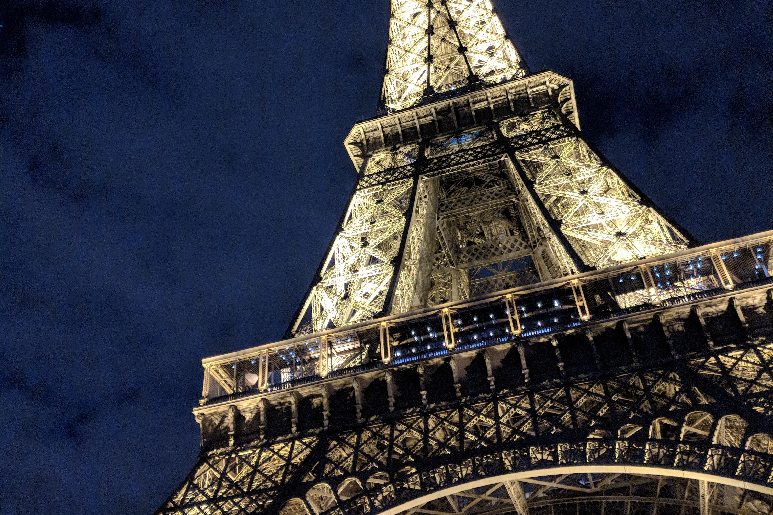 The sight of the Eiffel Tower at night.