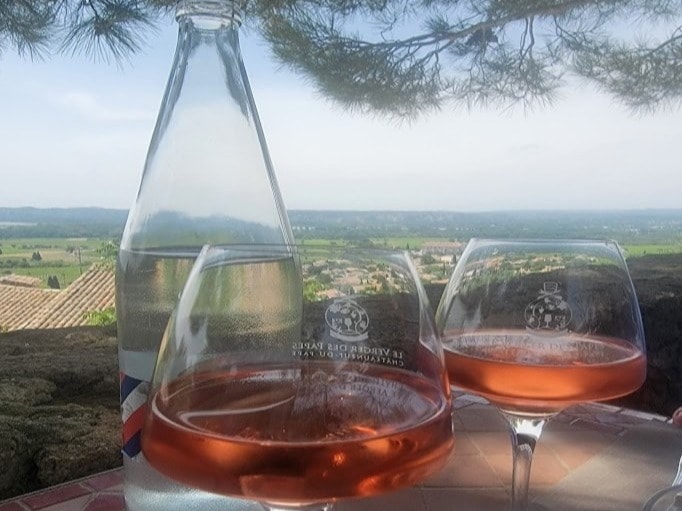 Wine glasses placed on a table outdoor during daytime.