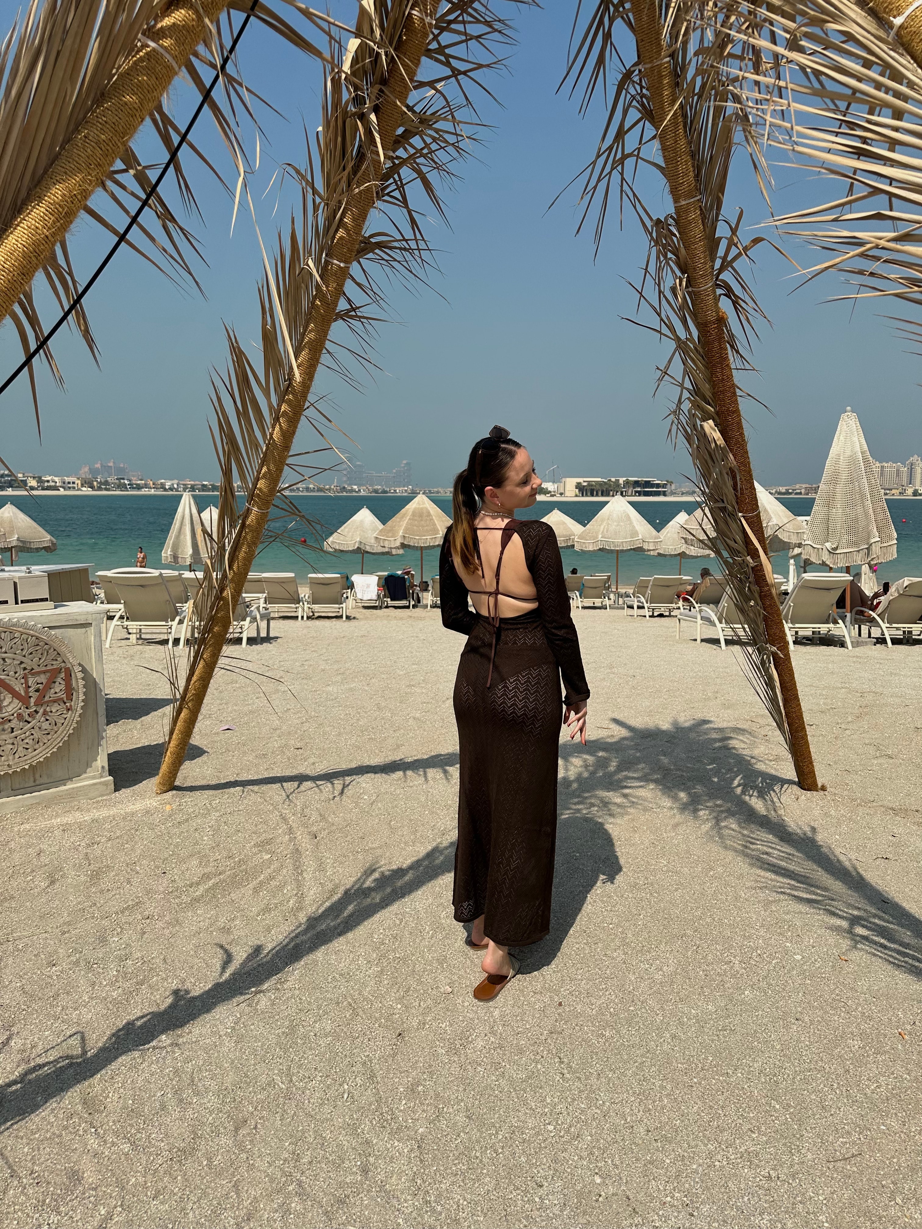 Picture of Georgia in black dress on beach