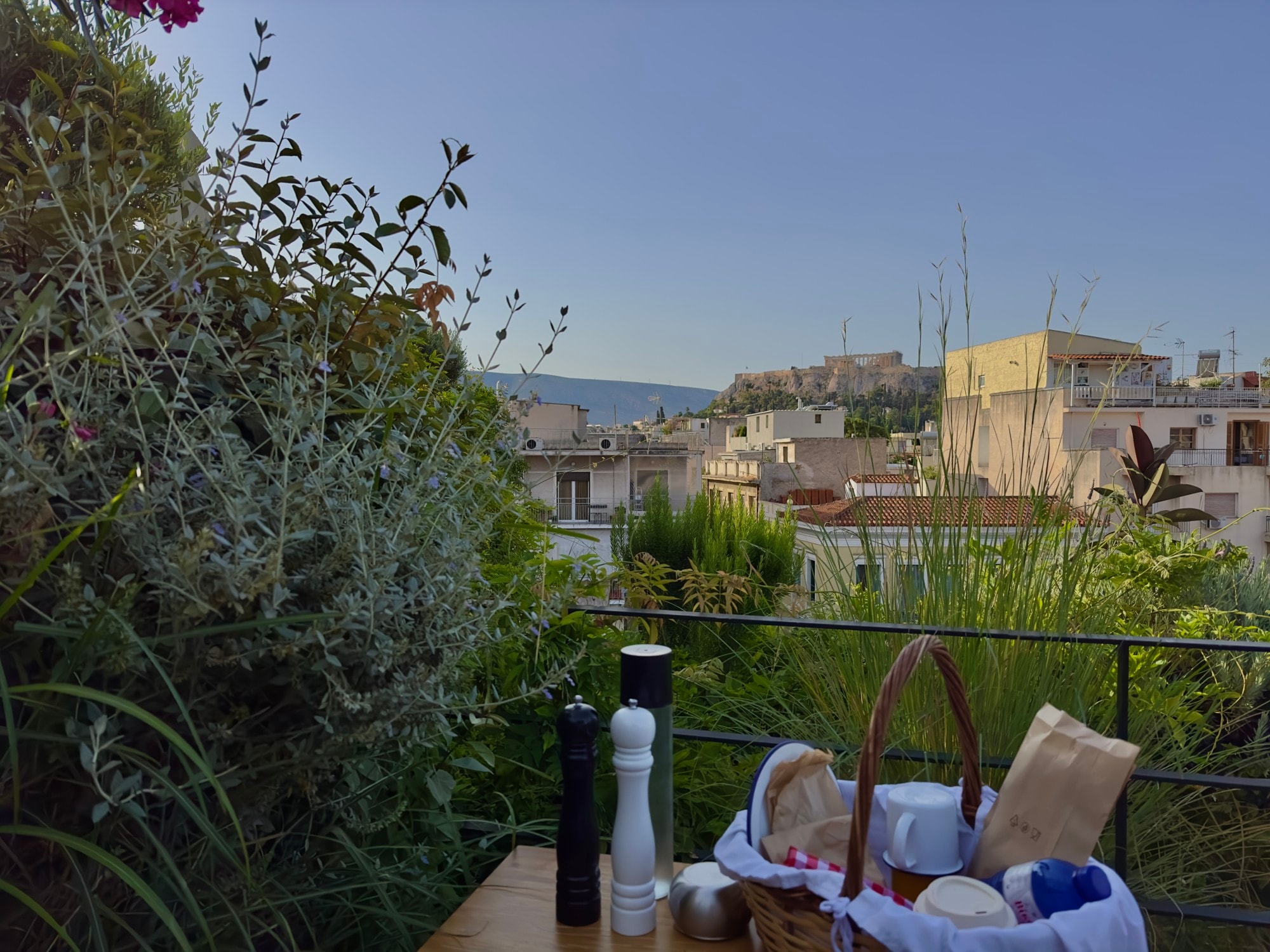 A basket of food sitting on a table on a rooftop during the daytime