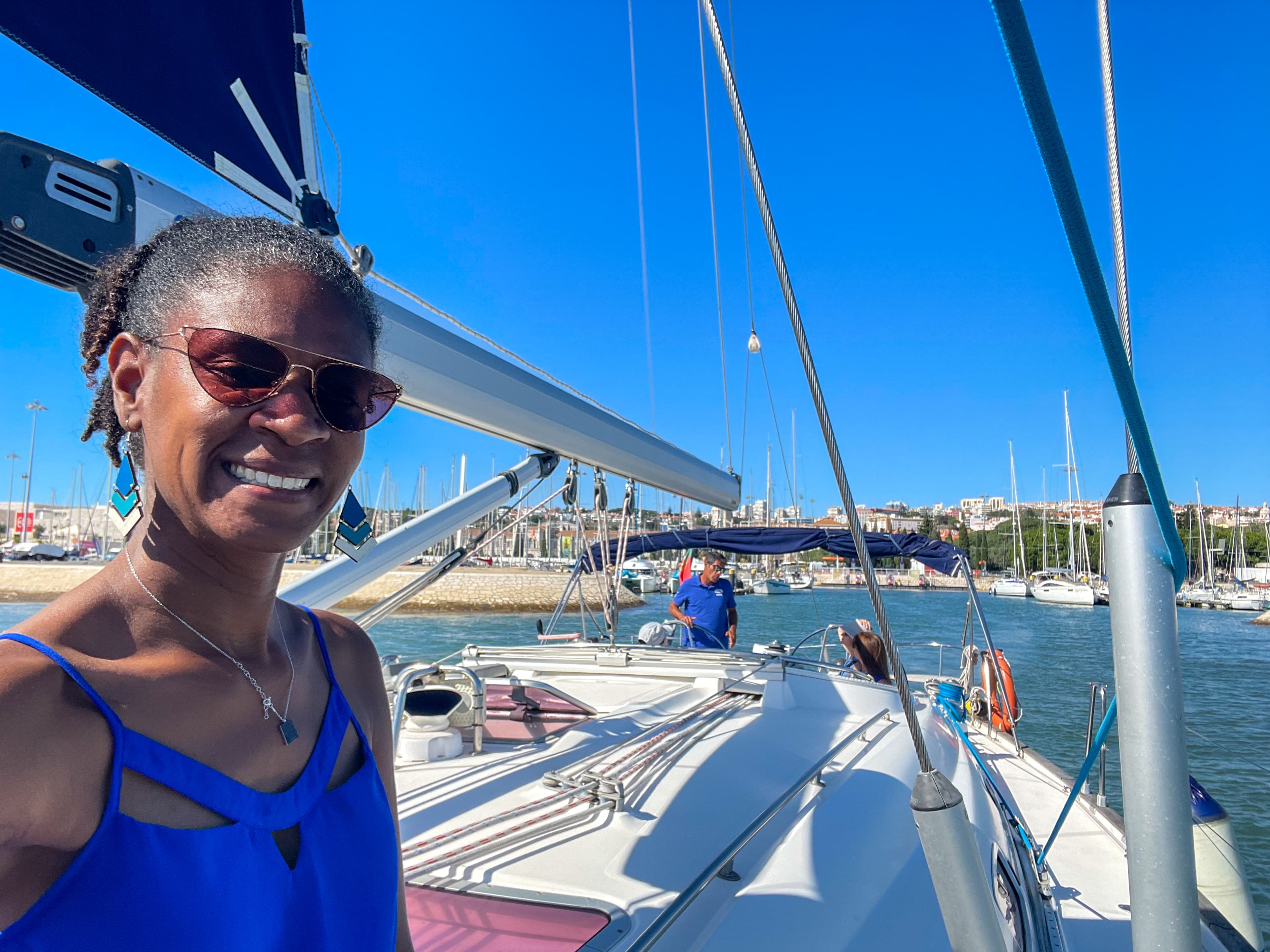 A girl on a sailboat in Portugal.