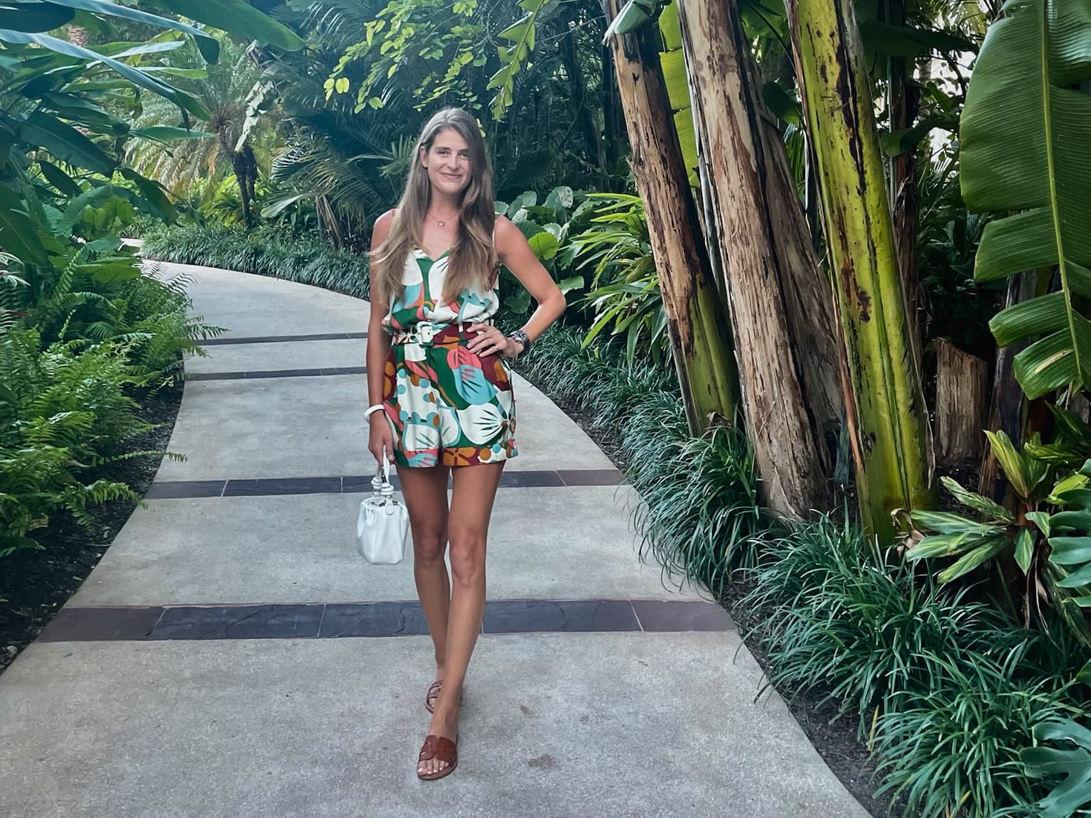 Posing for a photo in the lush green pathway