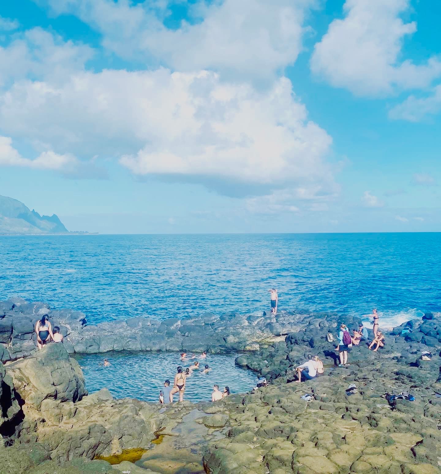 People swimming in Queen’s Bath