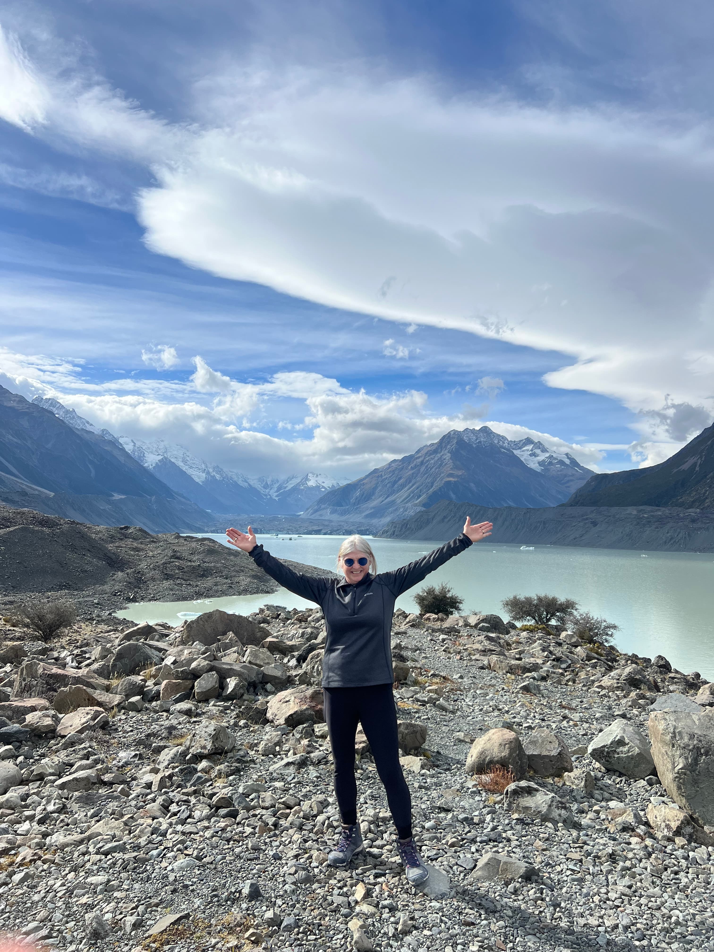 Travel advisor posing on a lakeside
