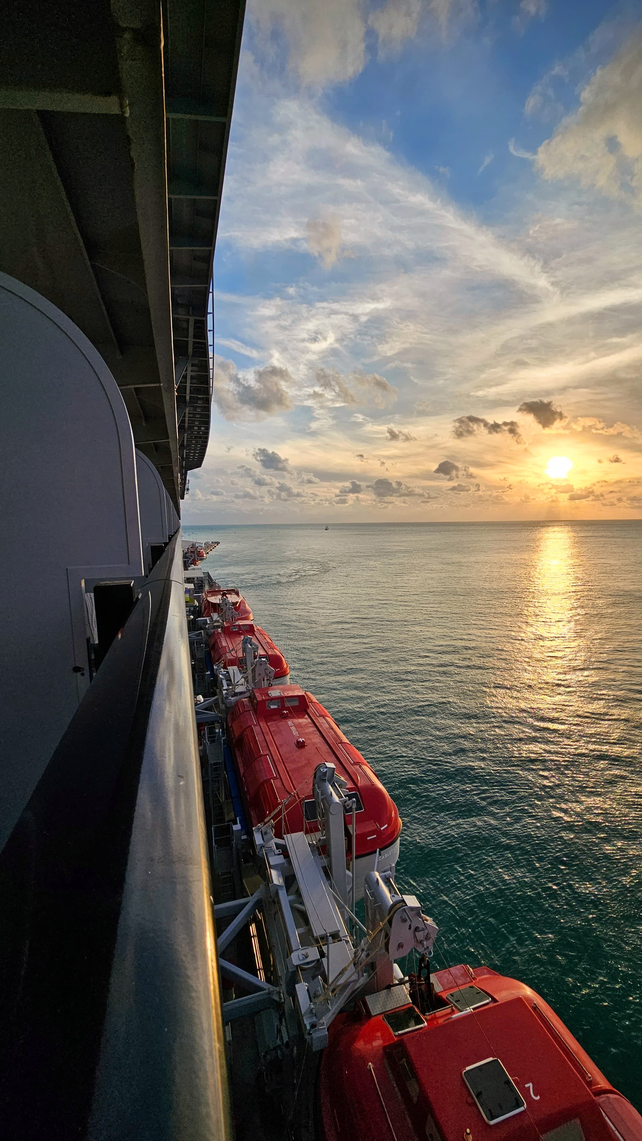 A beautiful view of the sea with a lovely sunset in the distance.