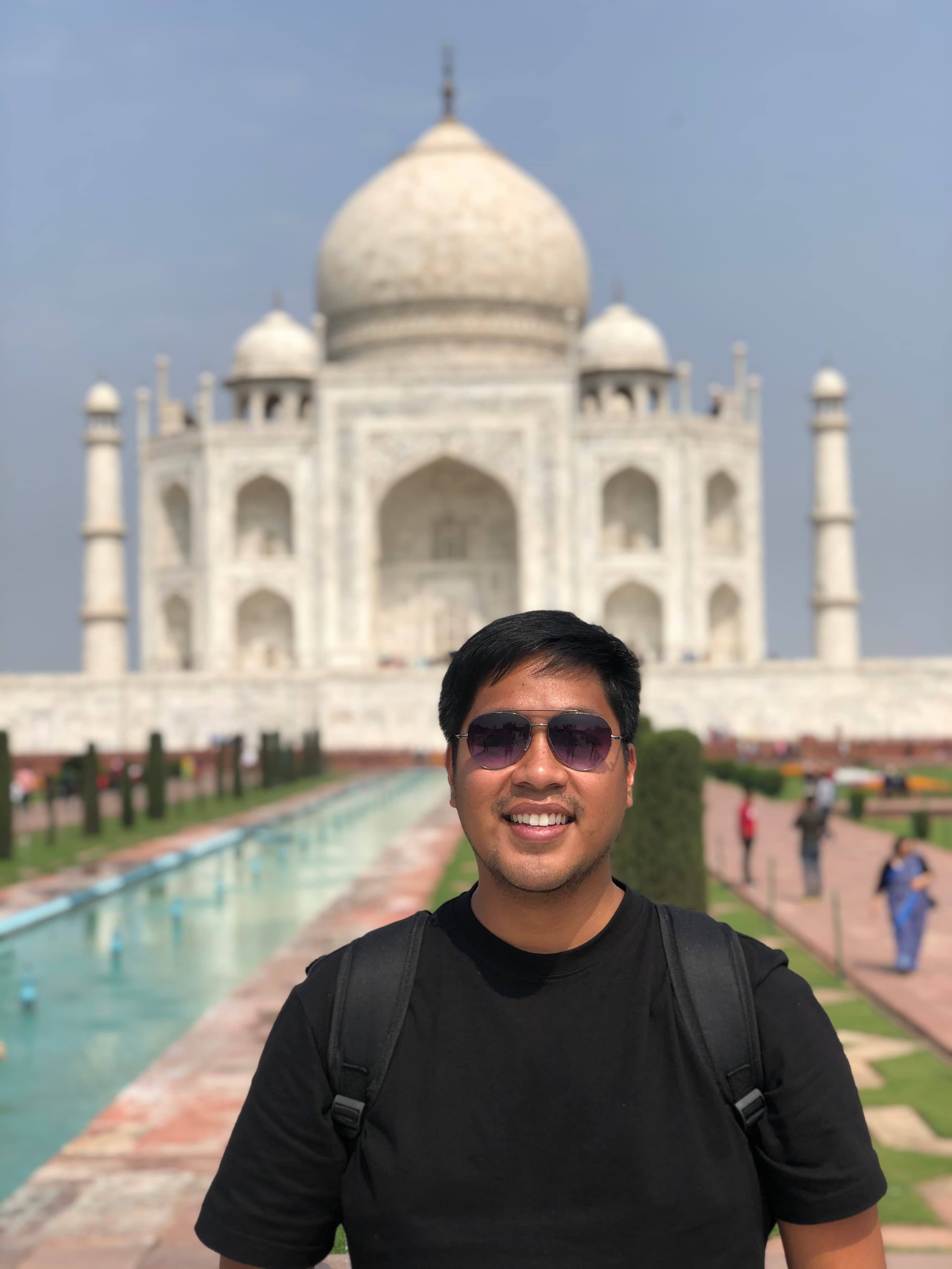 Travel advisor posing in front of the Taj Mahal