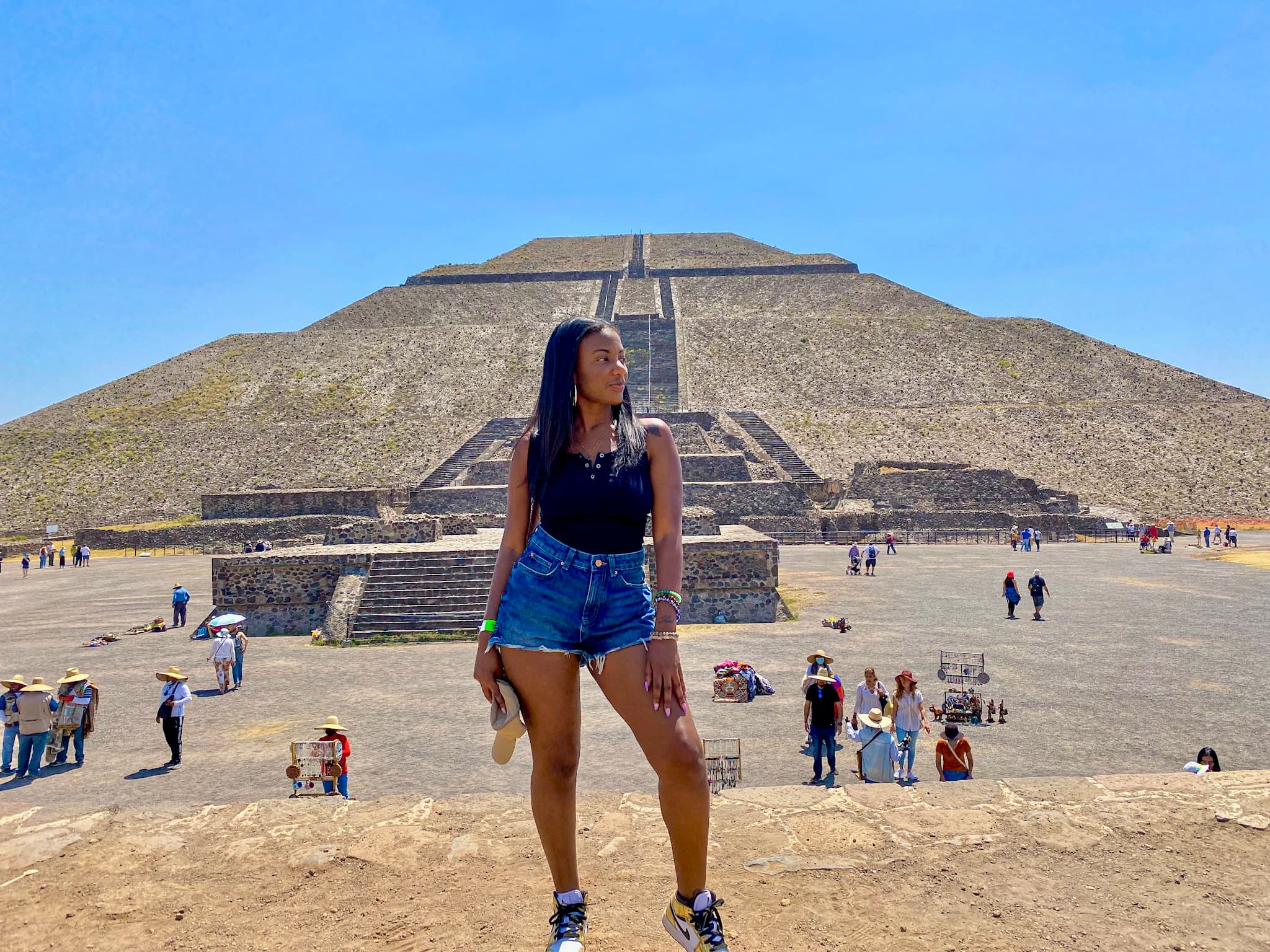 Travel advisor posing in front of an ancient place