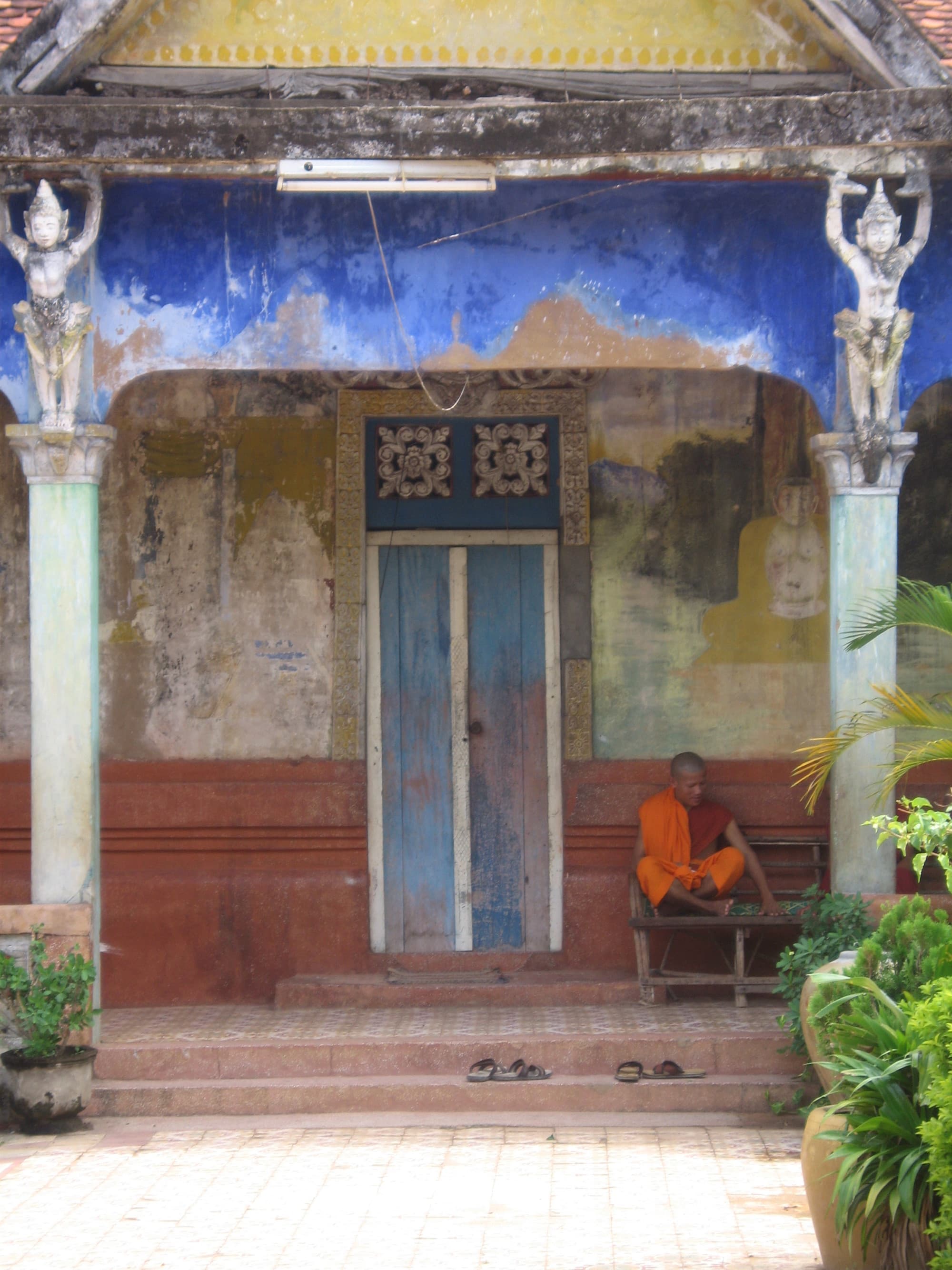 A charming porch with a blue door.