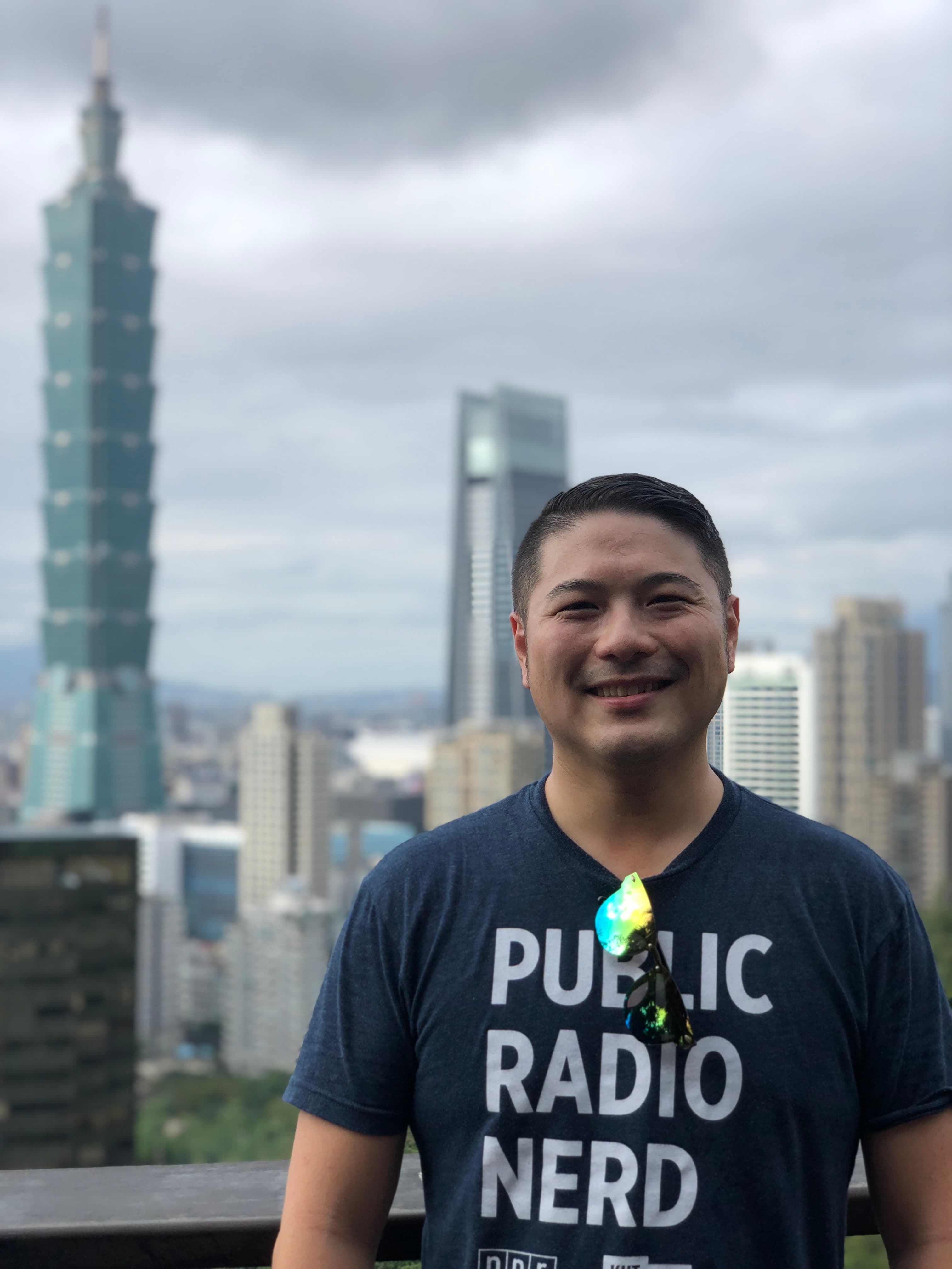 Posing for a picture with view of the city