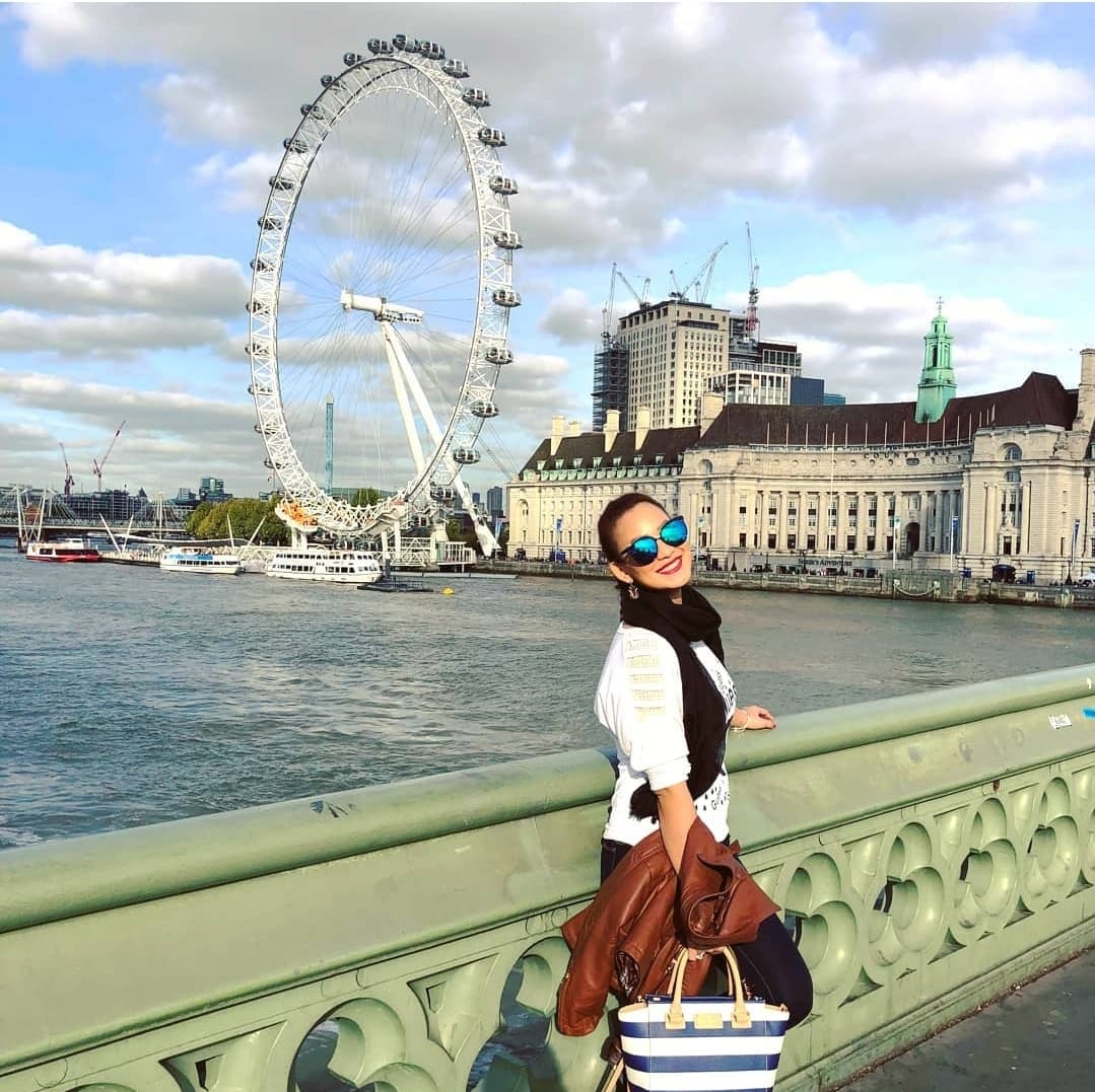 Posing for a photo on a bridge