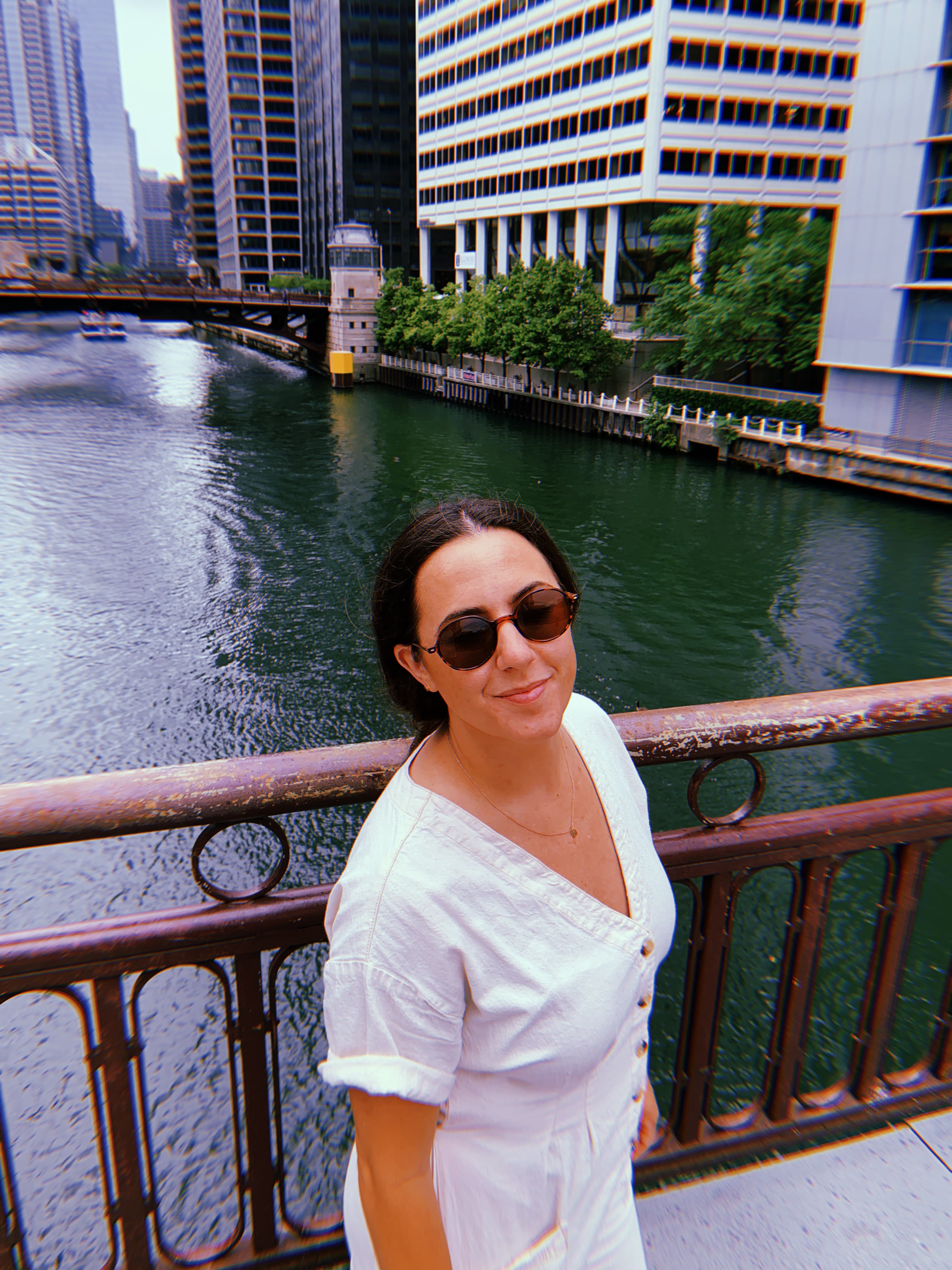 Emily posing in front of a river