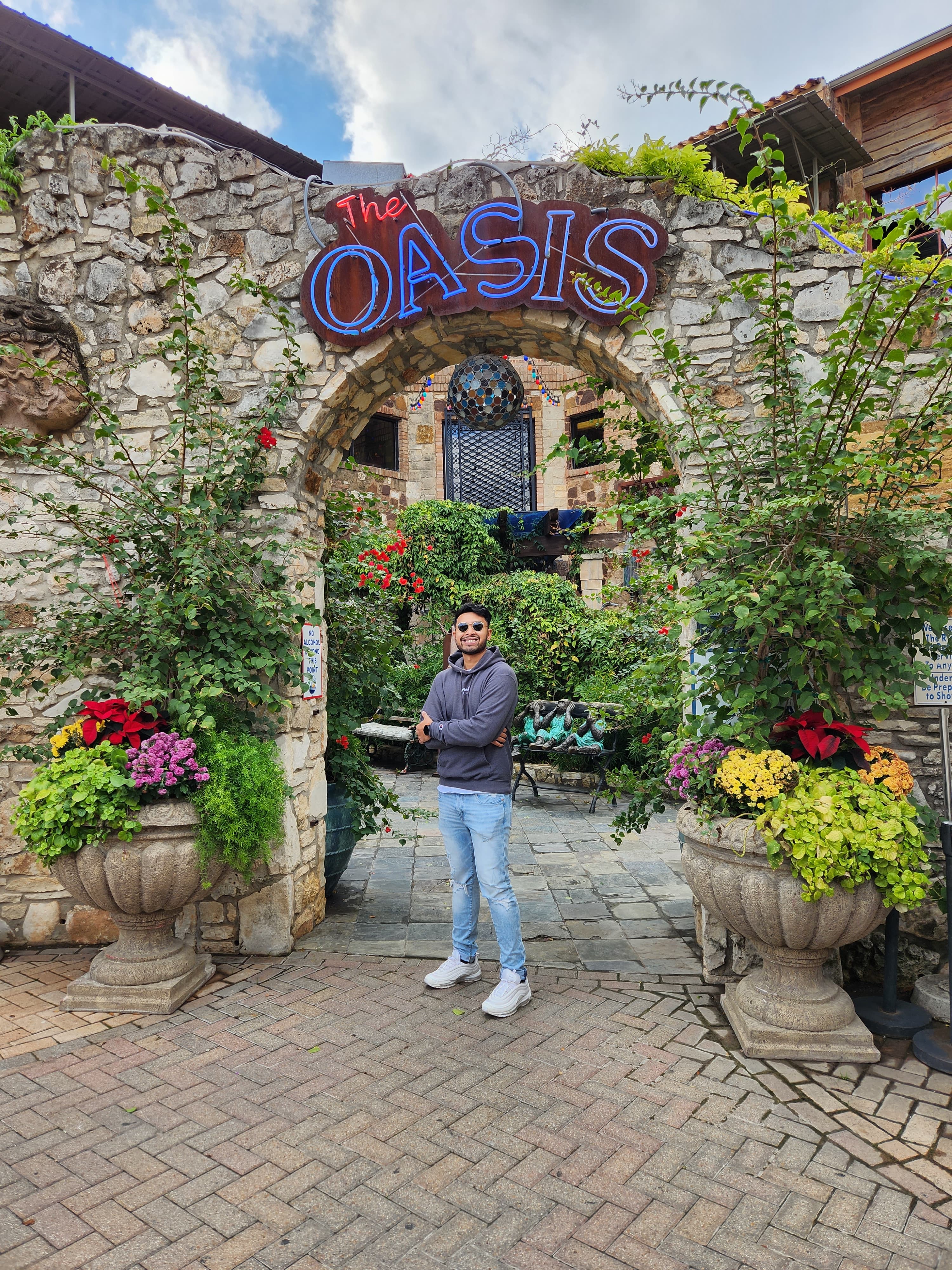 Shan posing in front of Oasis