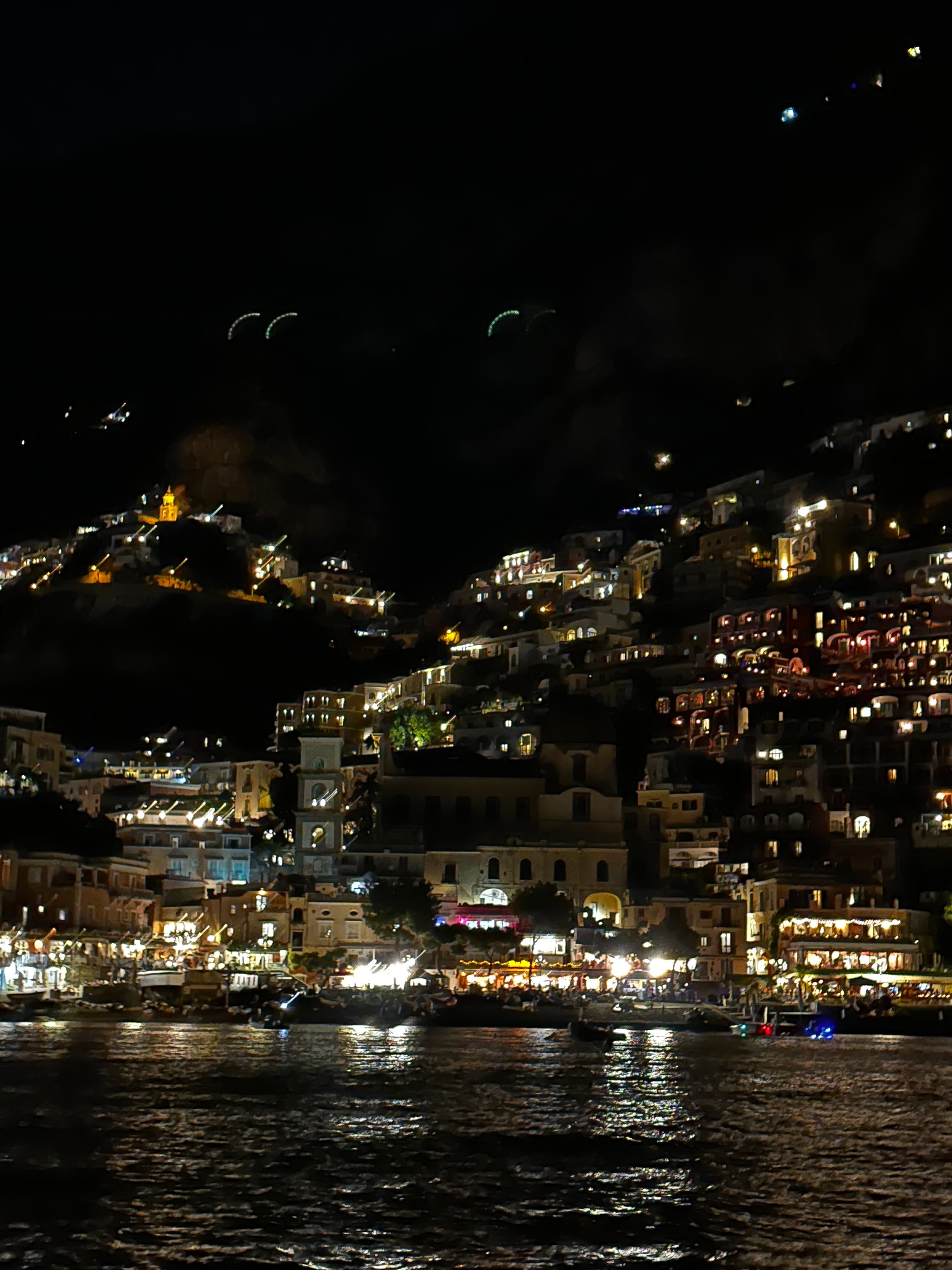 Picture of houses along water at night