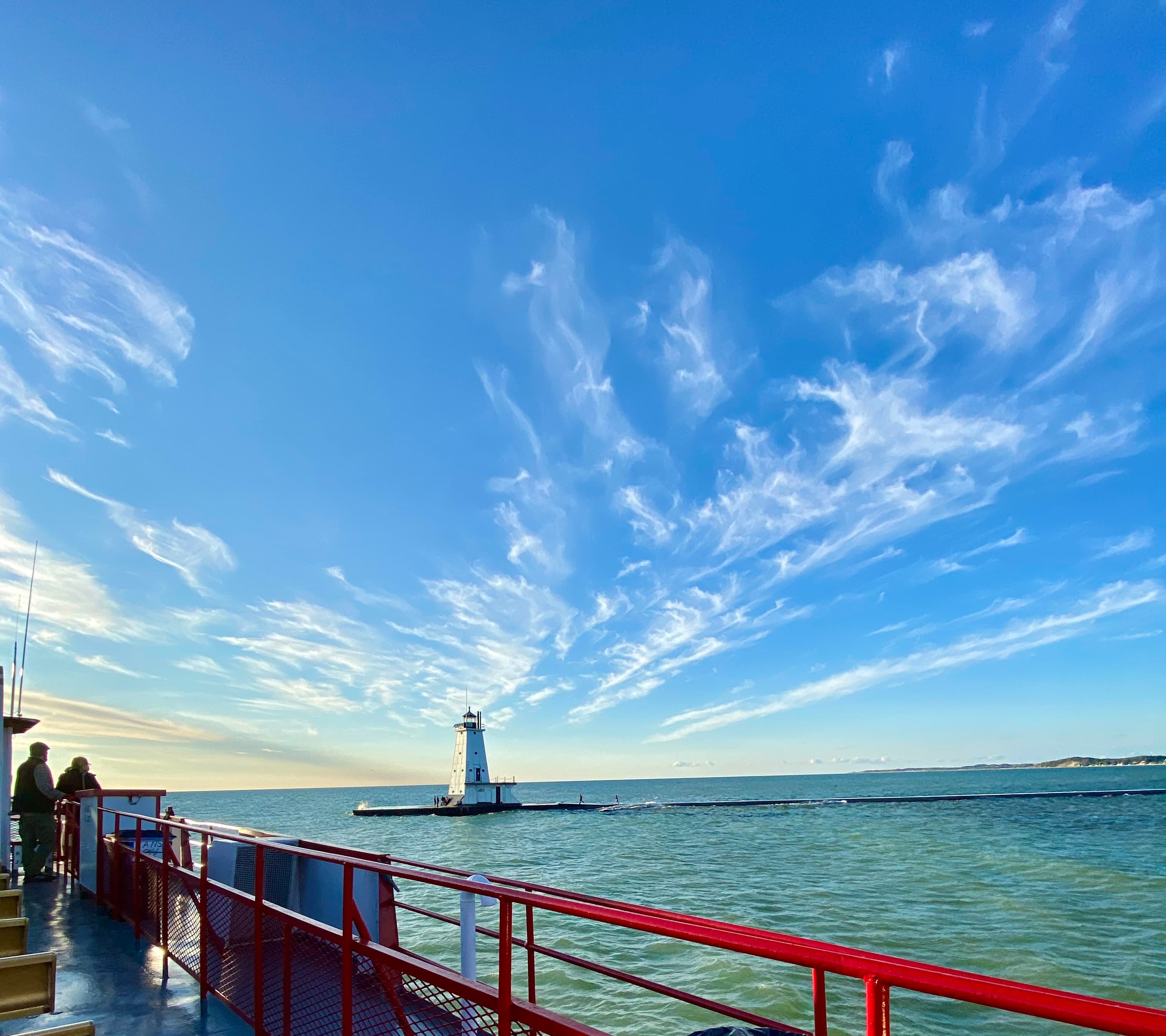 A bridge over a river under blue sky
