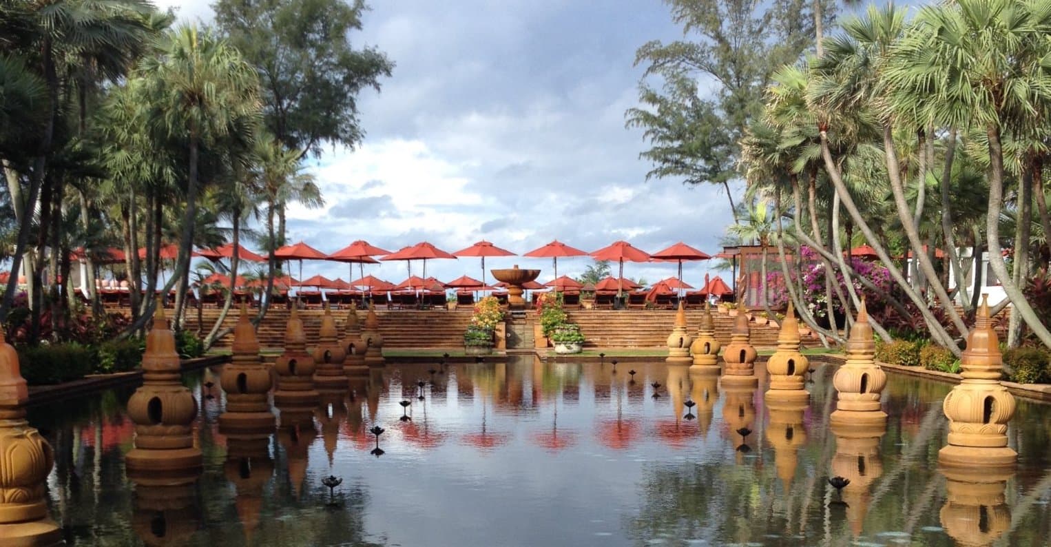 Red umbrellas near the temples