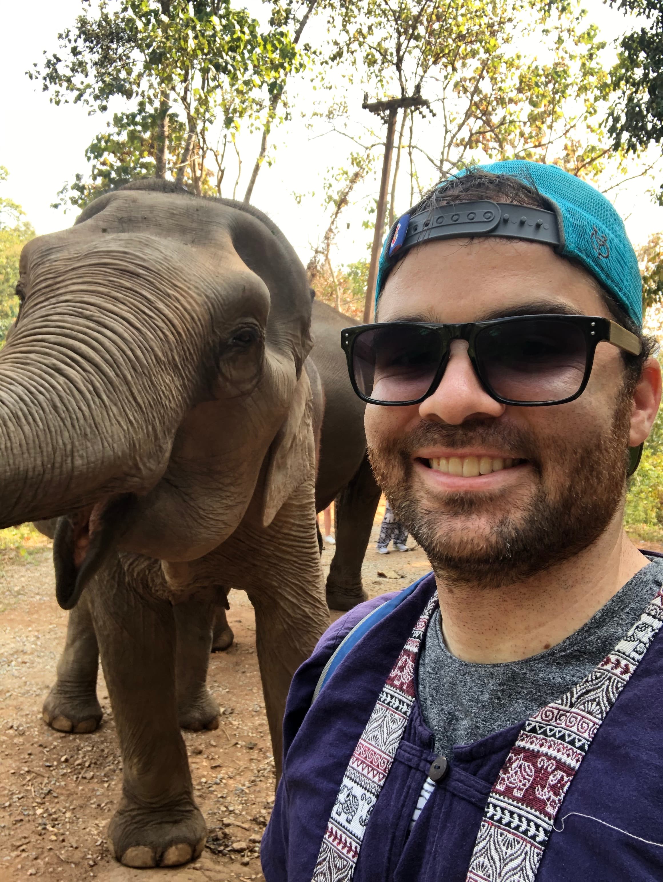Greg smiling in a selfie with elephant