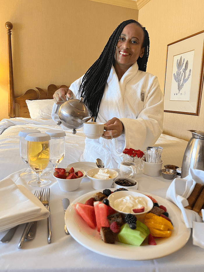 Travel advisor posing with food