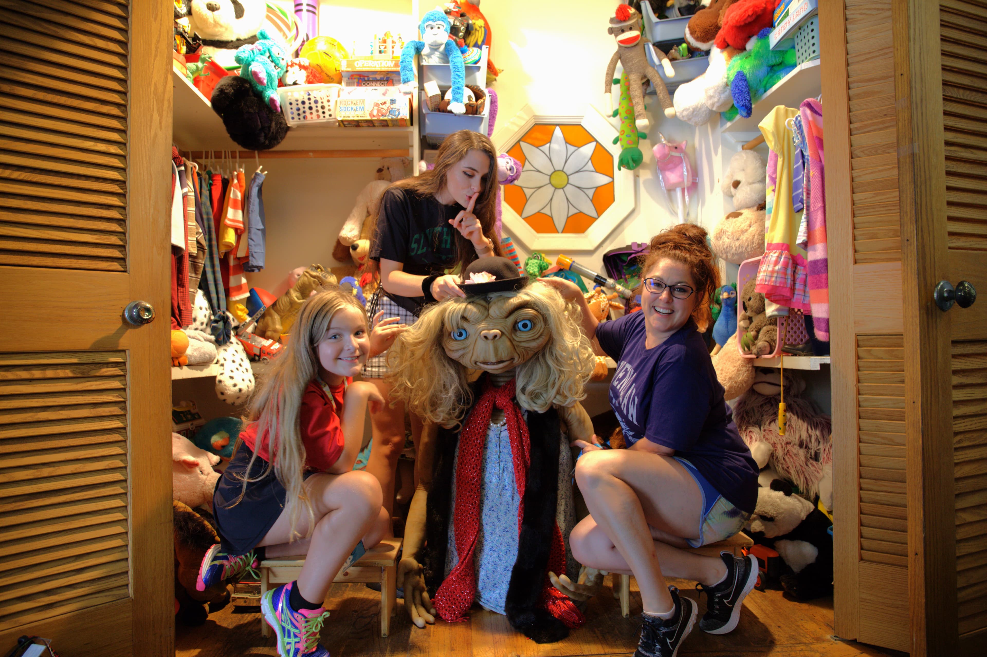 Travel advisor posing in a shop with kids