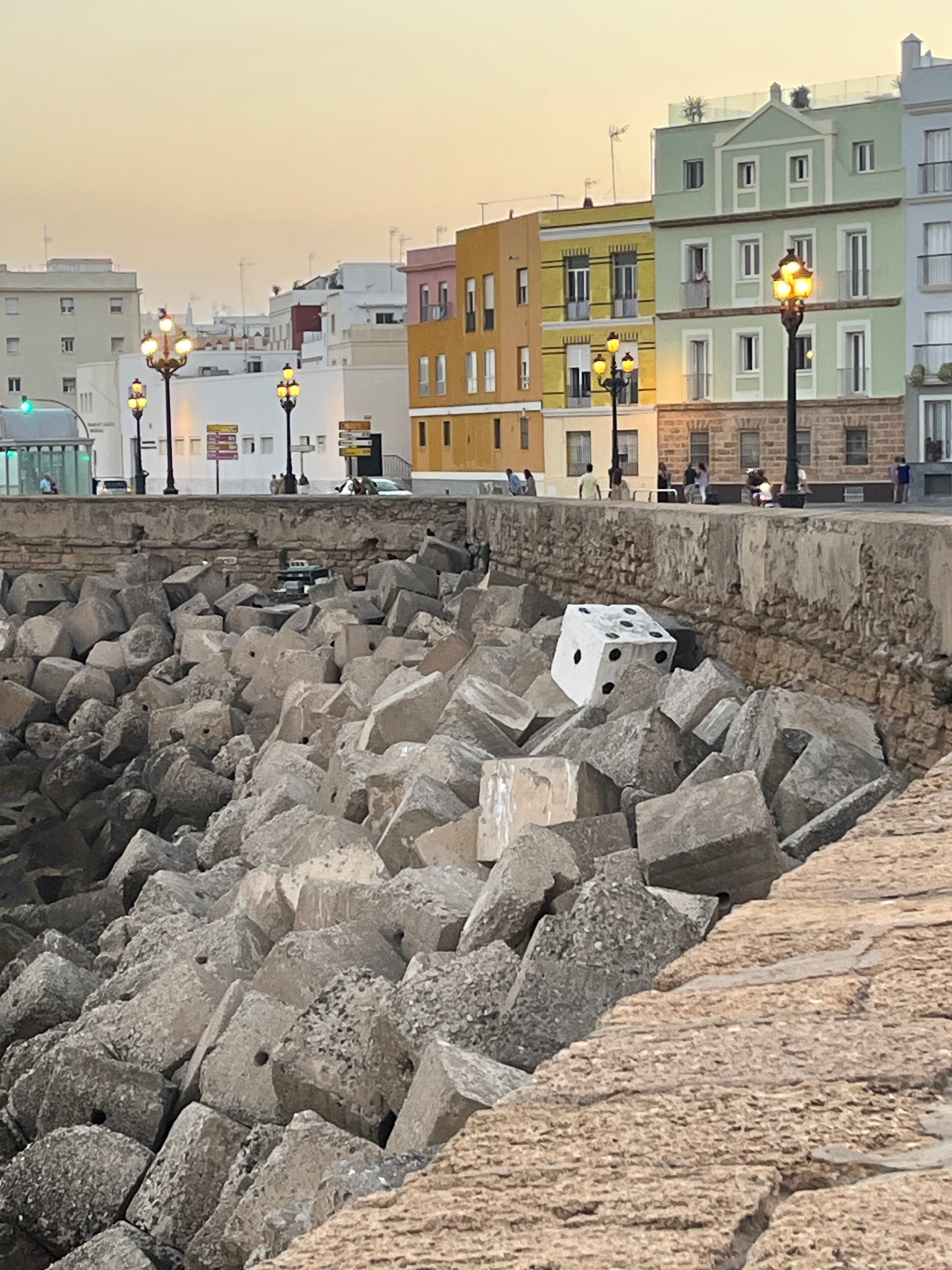 View of a canal-side rocks and houses