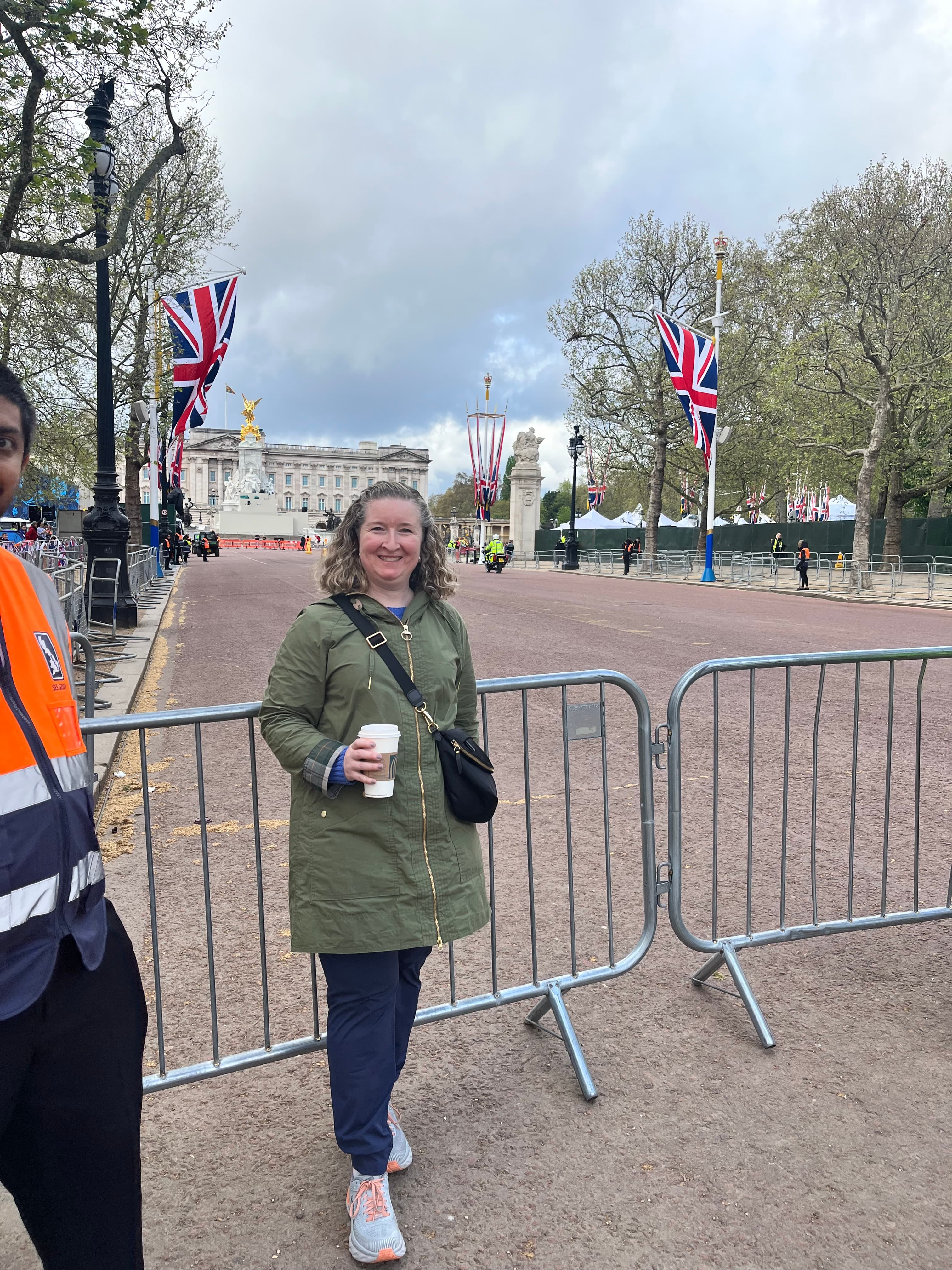 Posing for a picture with Buckingham Palace in the background