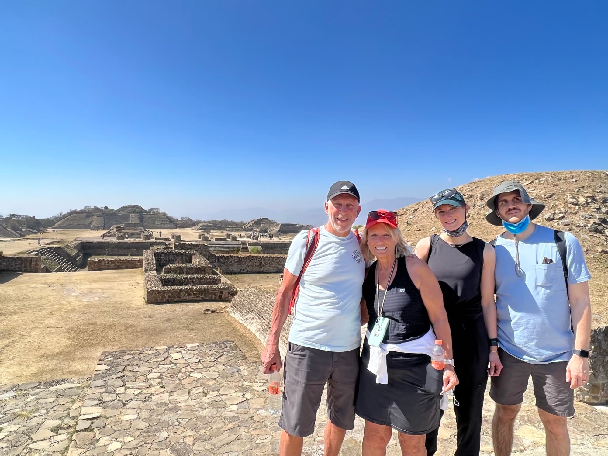 A group of 4 people outdoors.