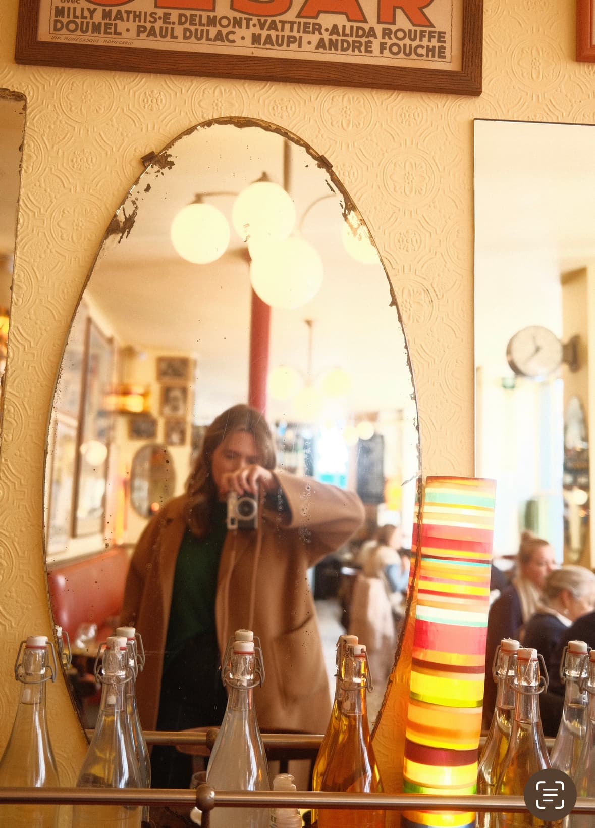 Travel advisor posing in a mirror in a shop