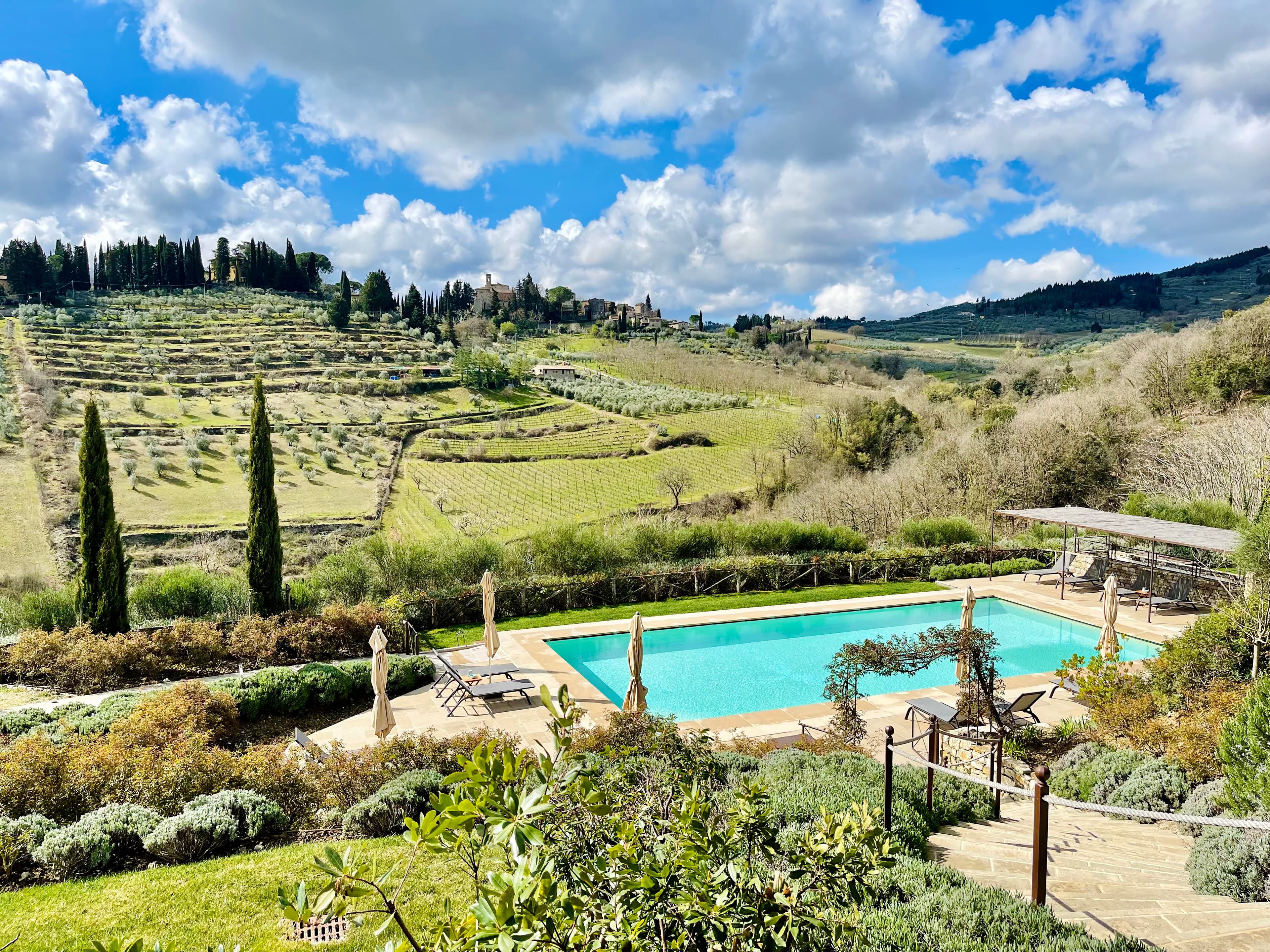 Lush green valley view with a pool