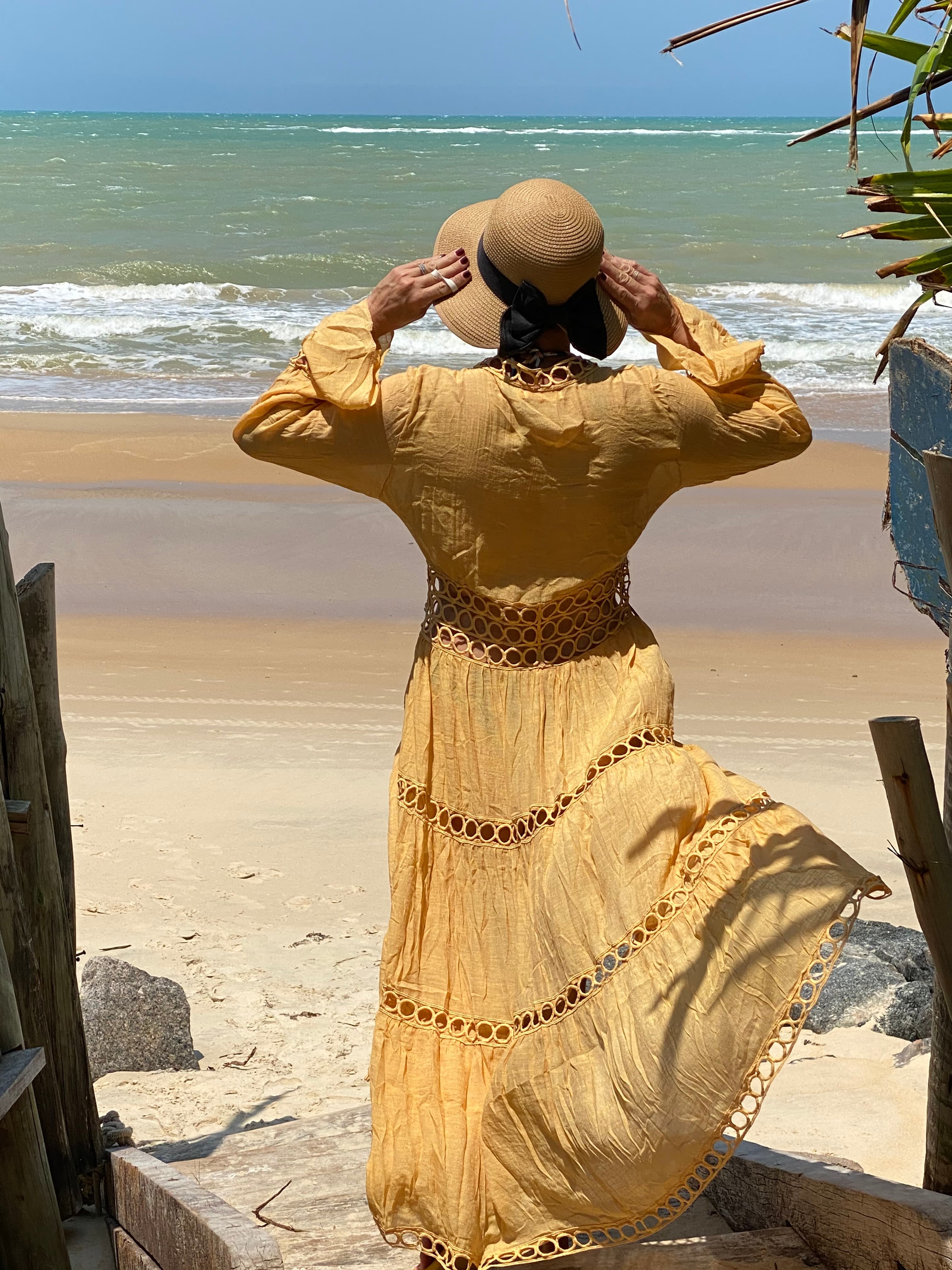 Posing with a hat on the beach