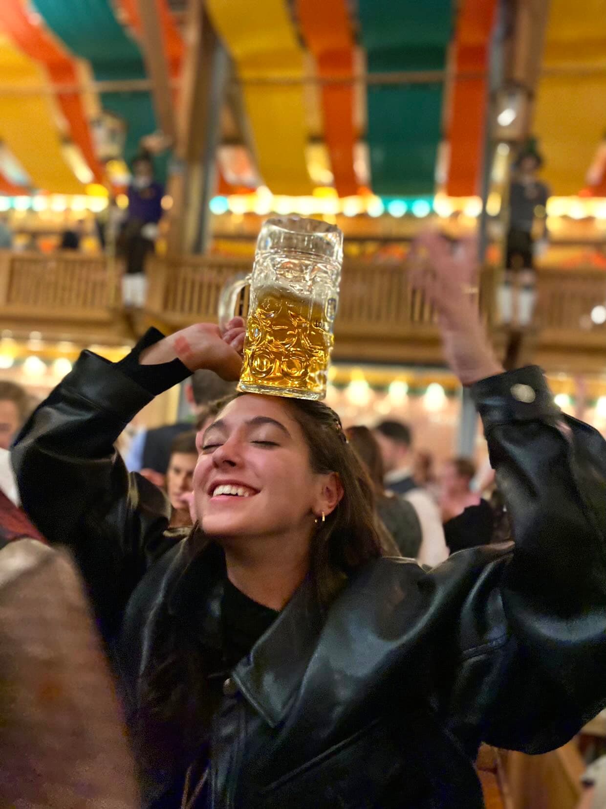 Travel advisor posing with a beer on her head