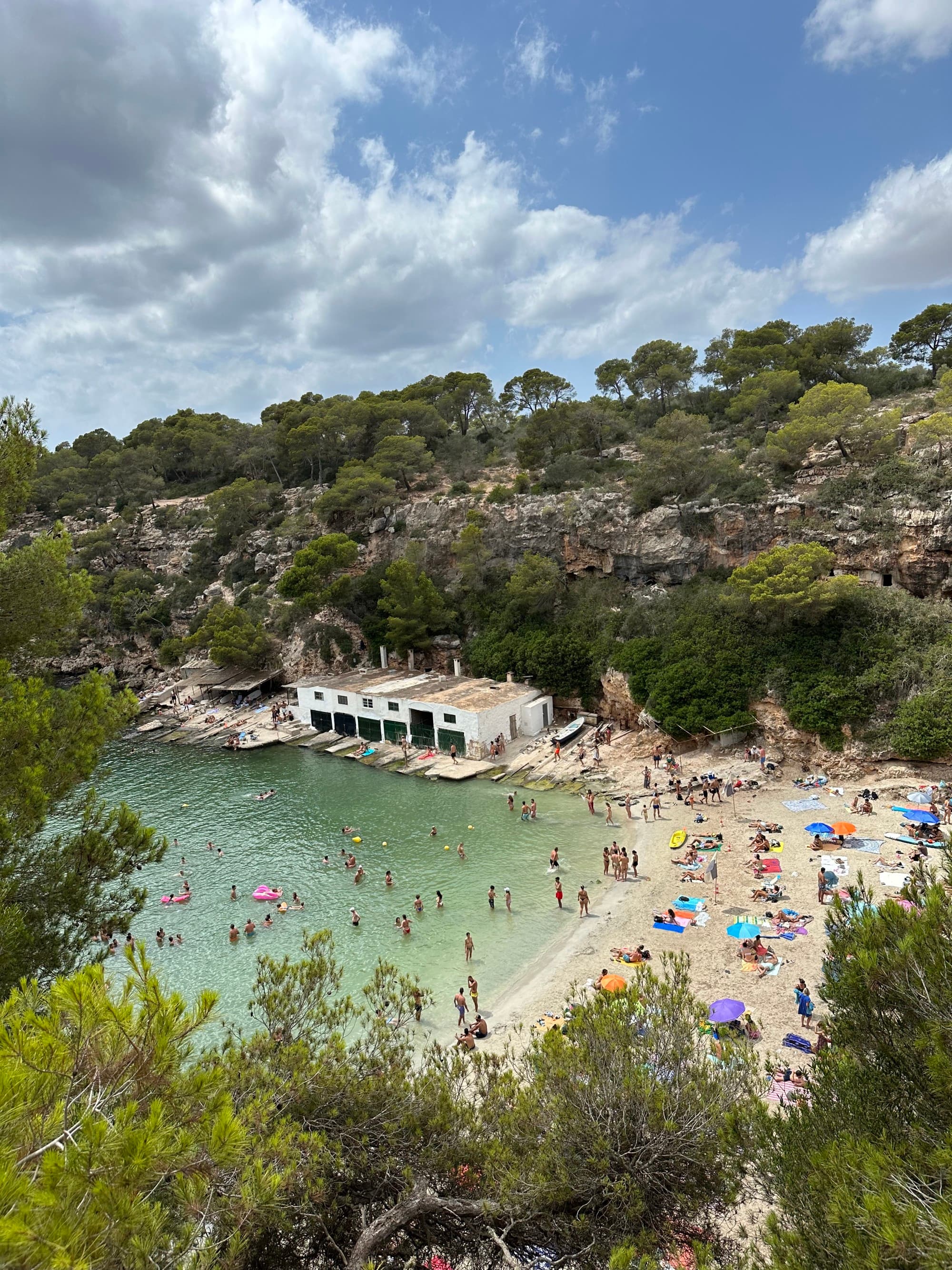 Aerial view of a water body with people on its shore.