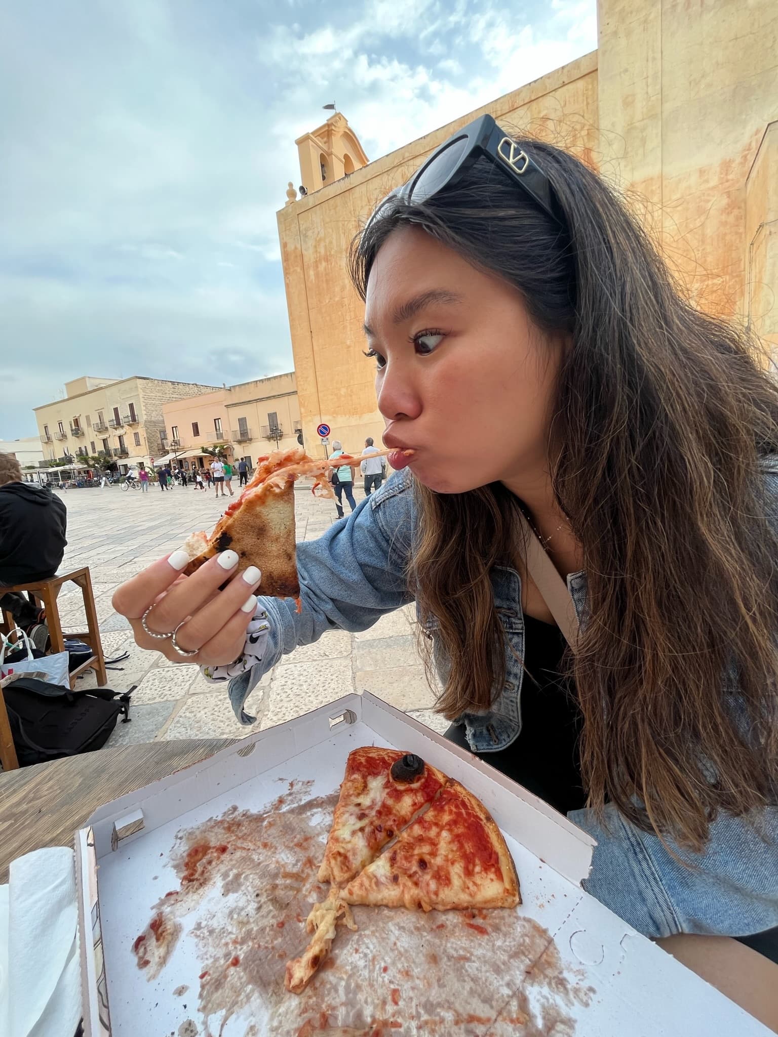 Picture of Katherine eating pizza