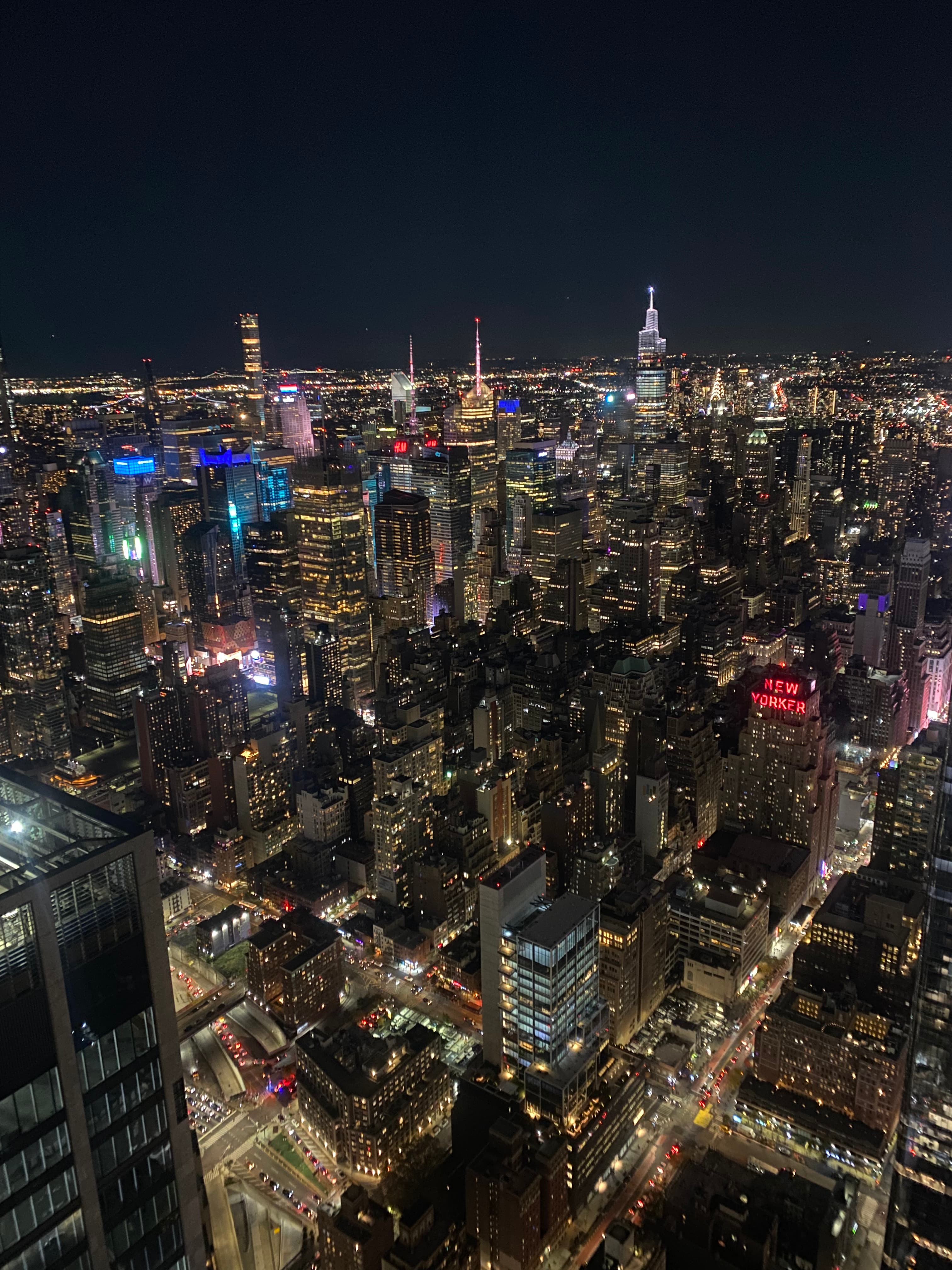 An aerial view of the city lit up at night