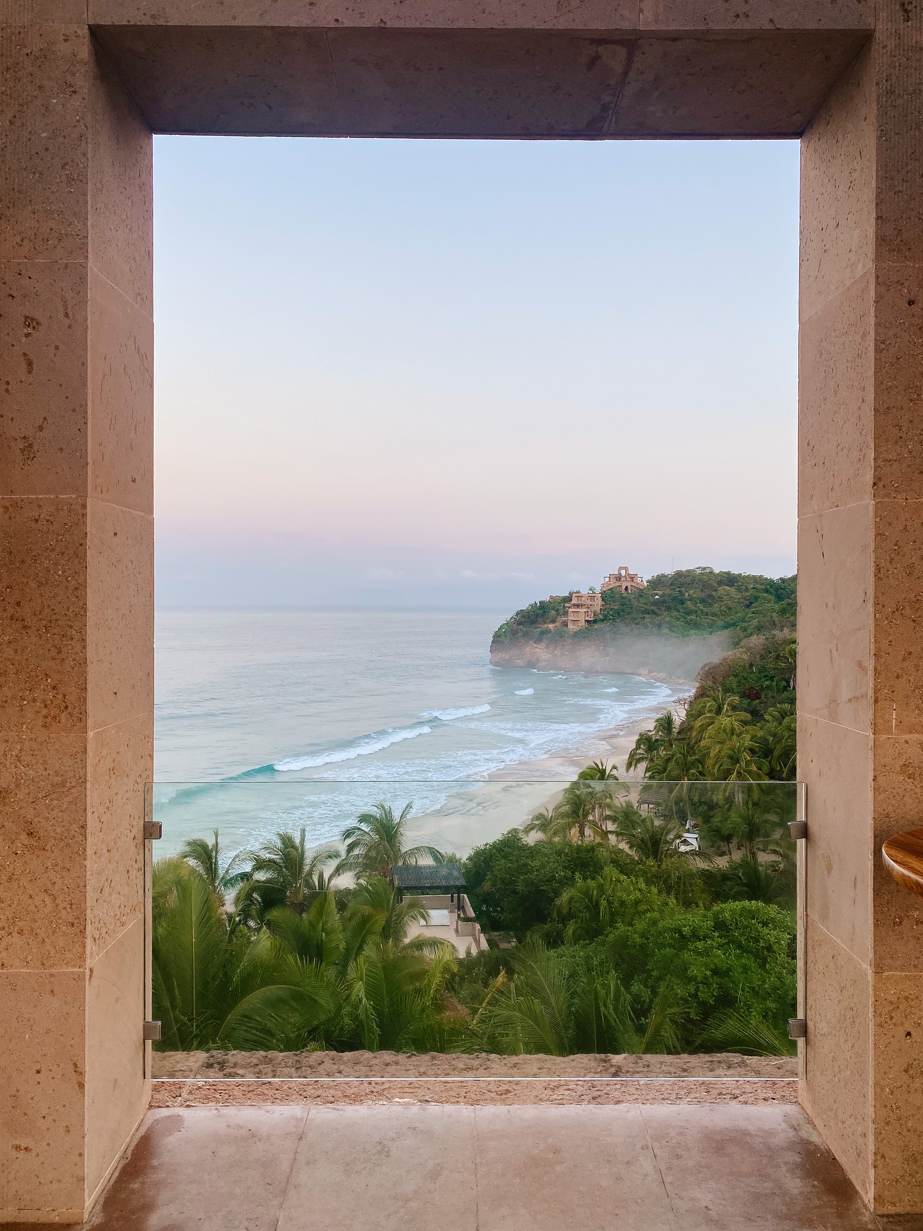 An ocean view through a window.