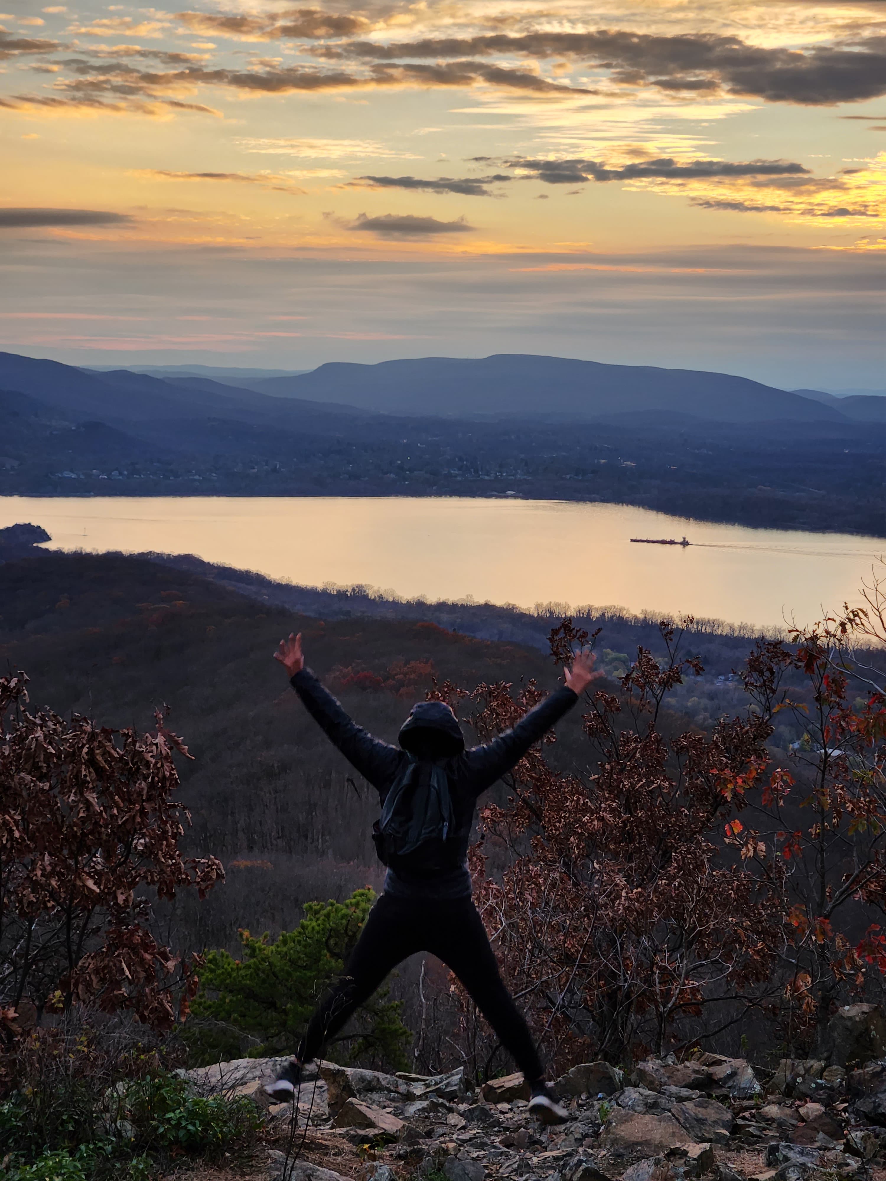 Shan posing in sunset beside sea