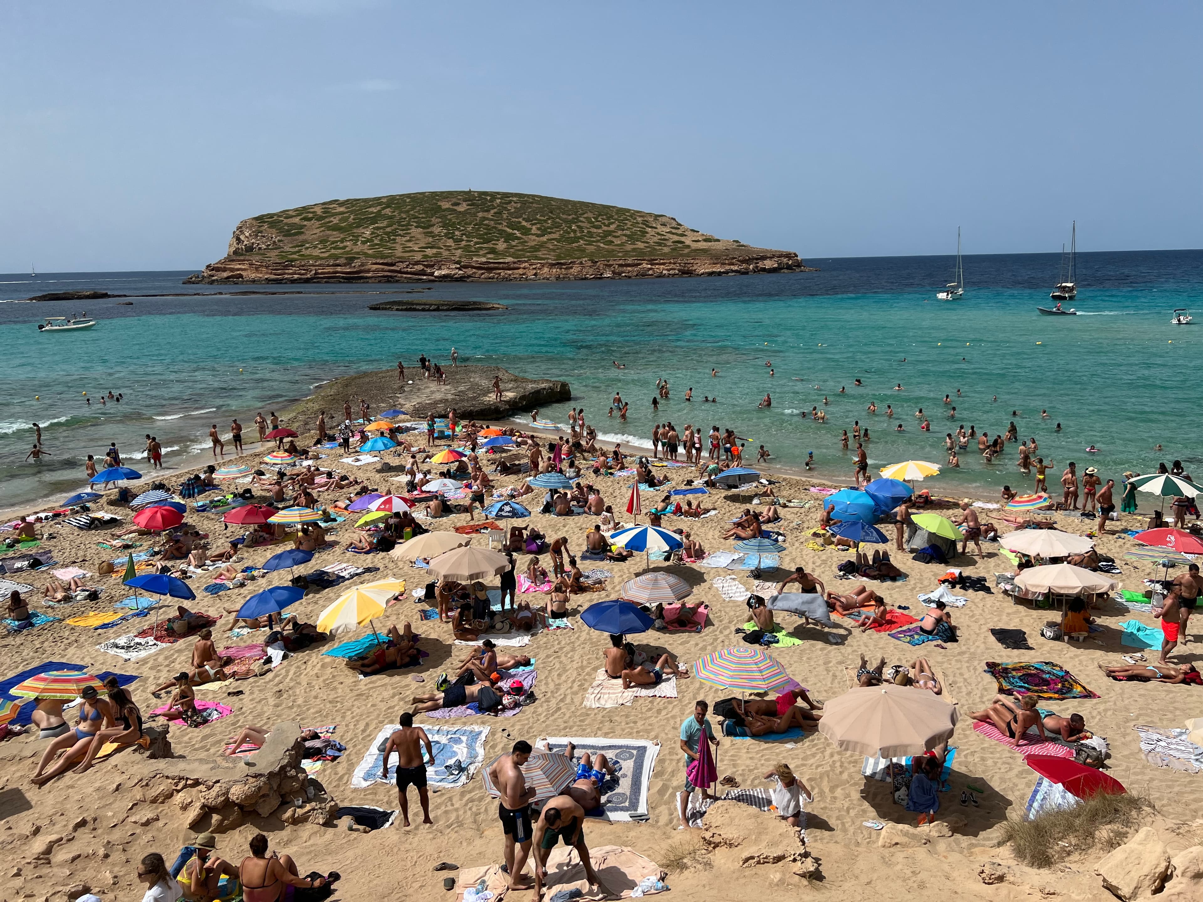 People sun bathing on the beach