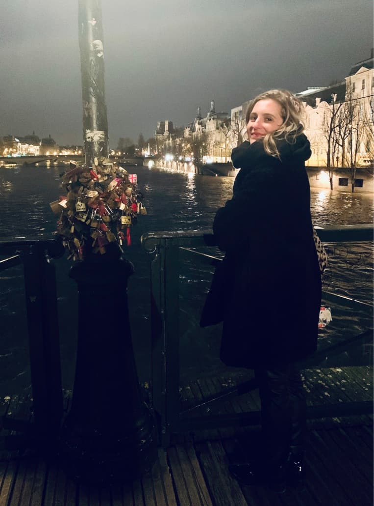 Picture of Carly in black dress near water