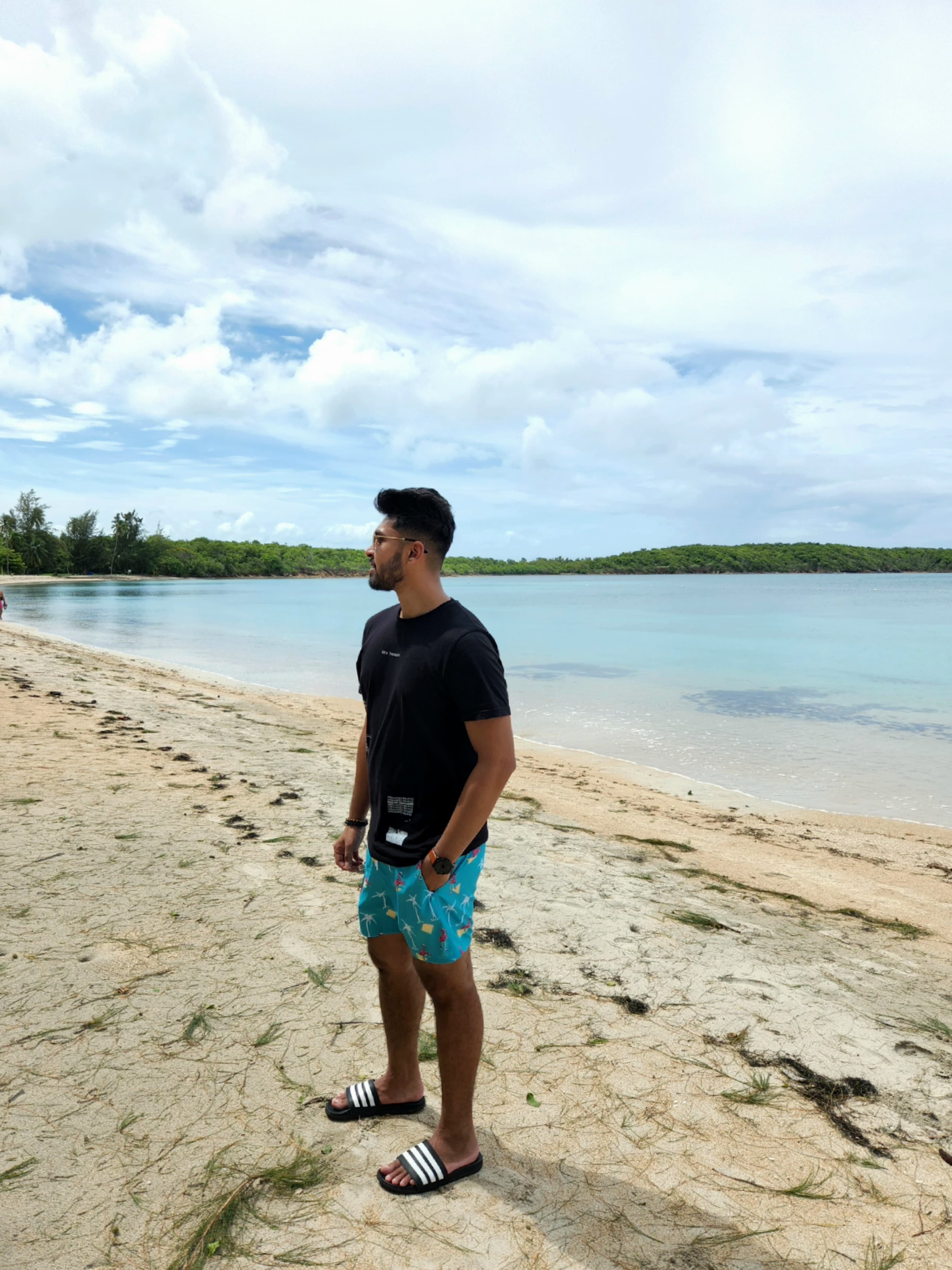 Shan posing on a beach