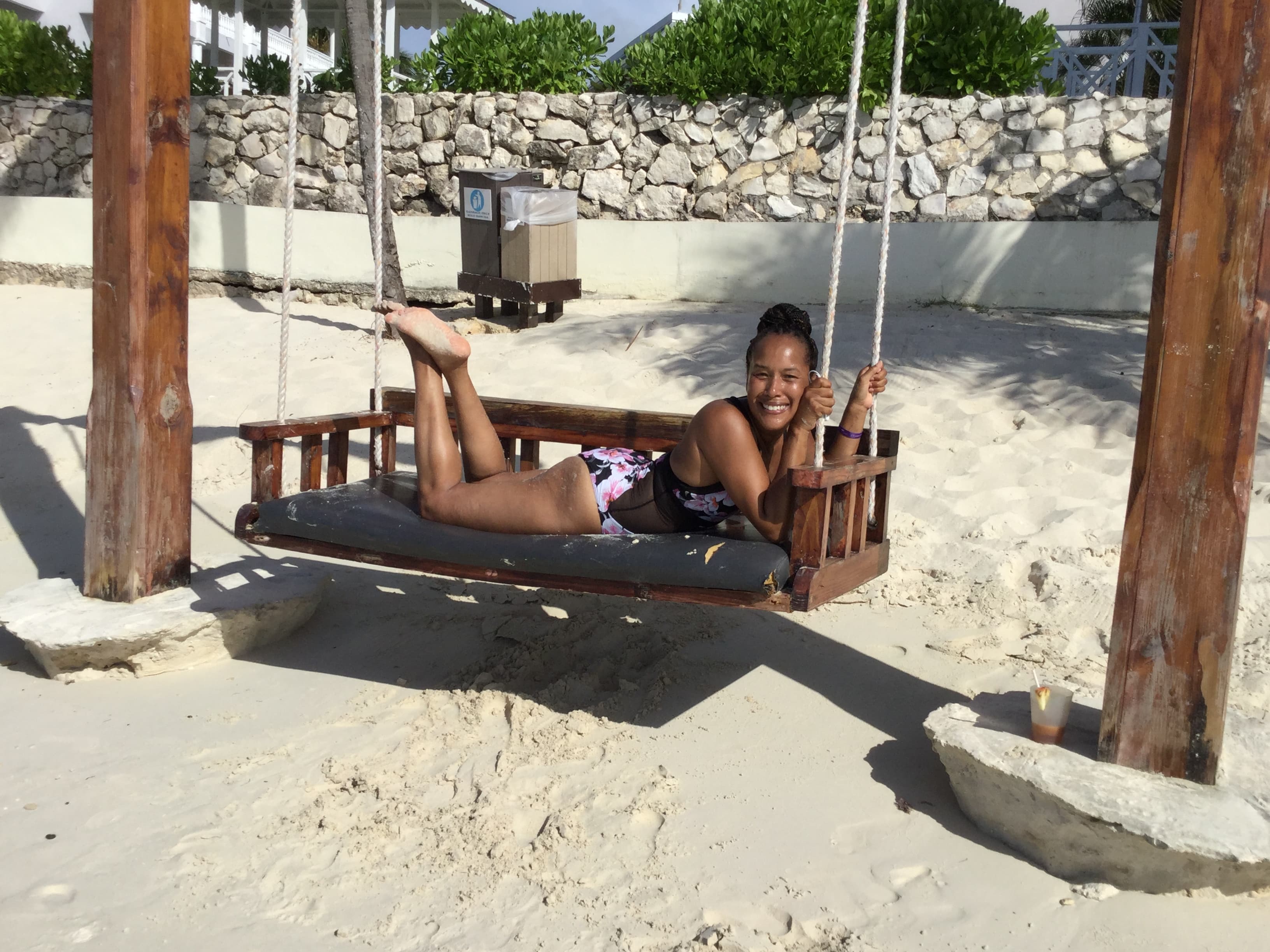 Travel advisor posing on a swing