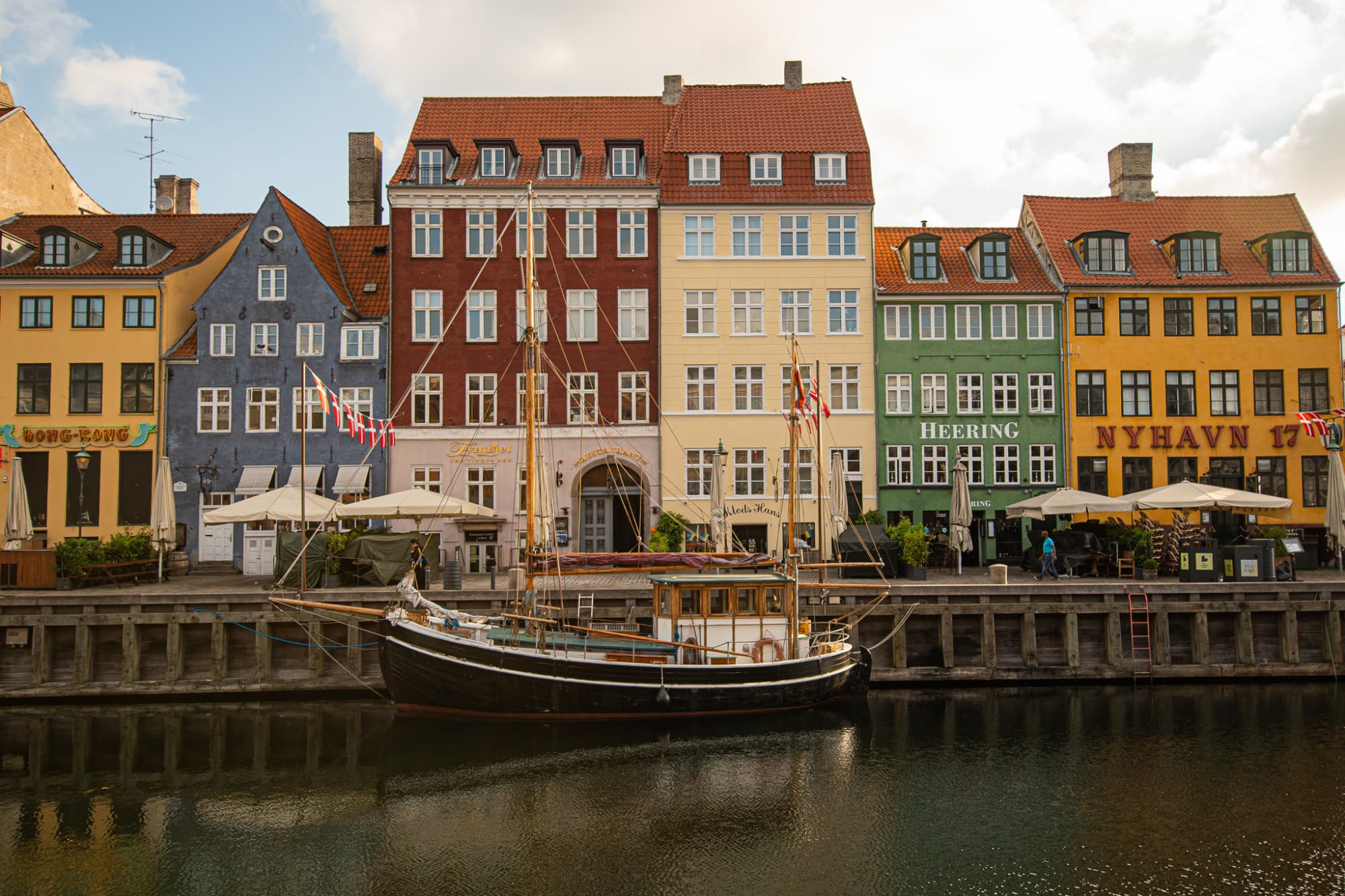 A canal in front of colorful city buildings.