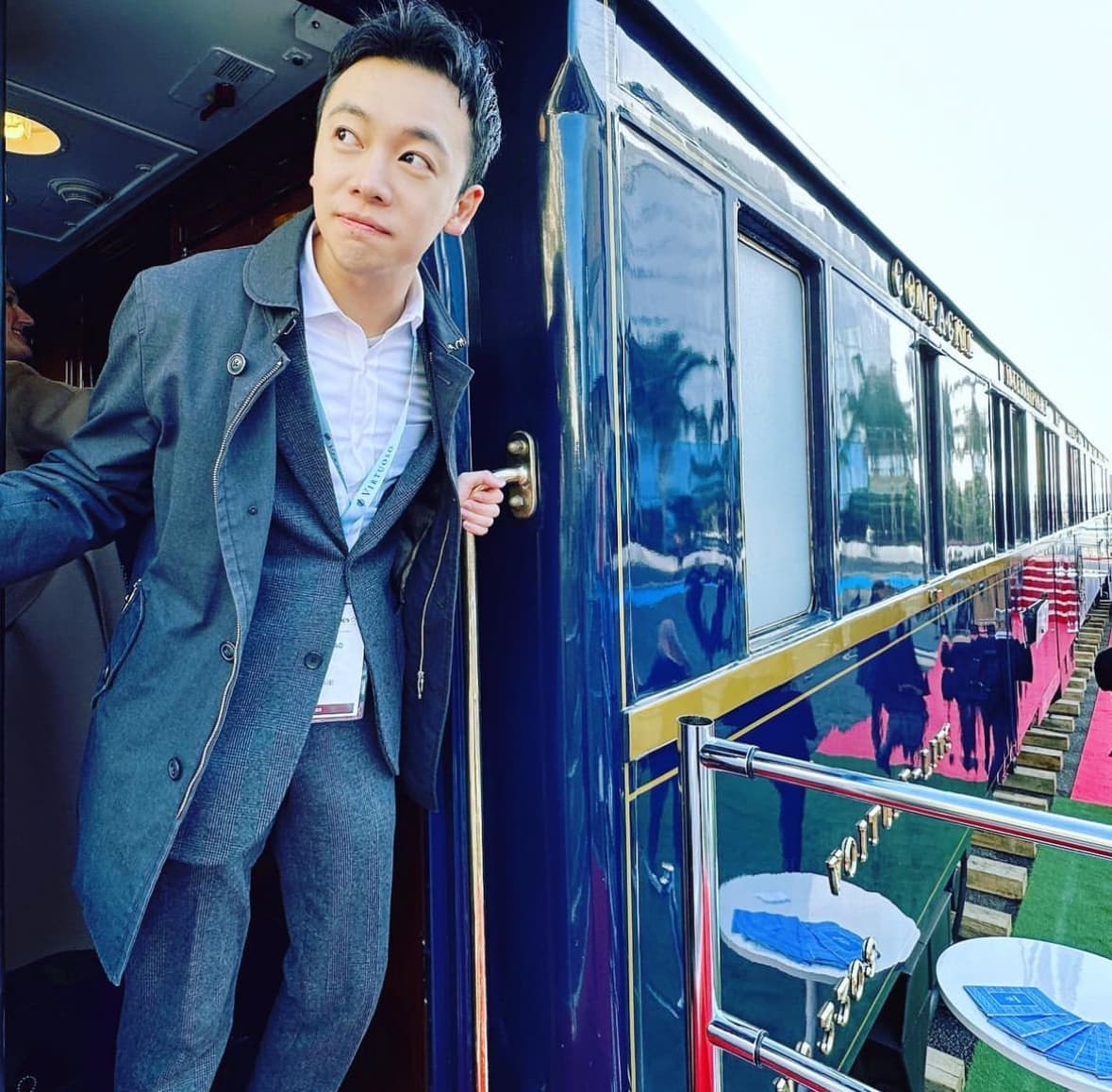 Posing for a photo standing on a train