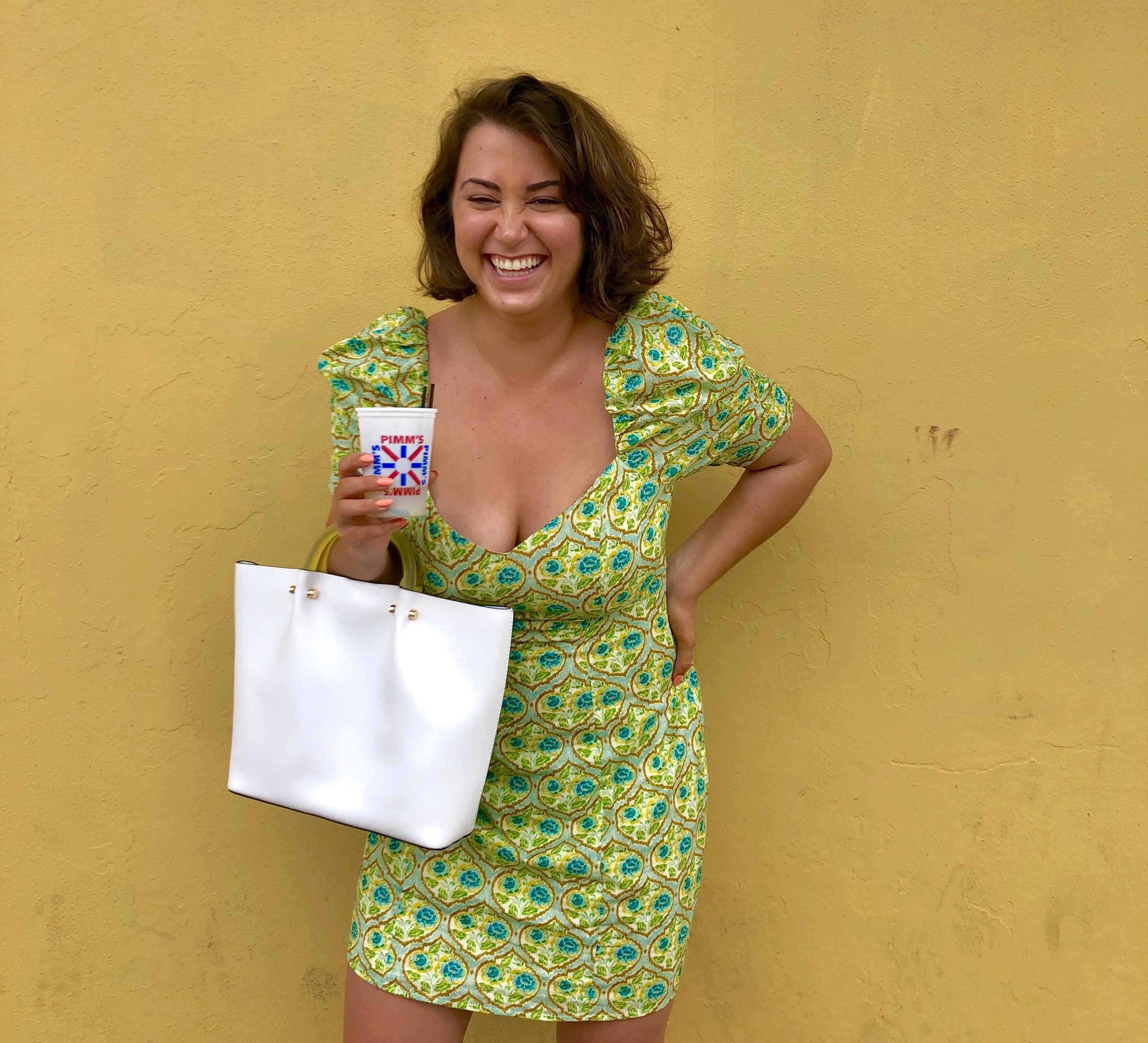 Posing with a drink in hand