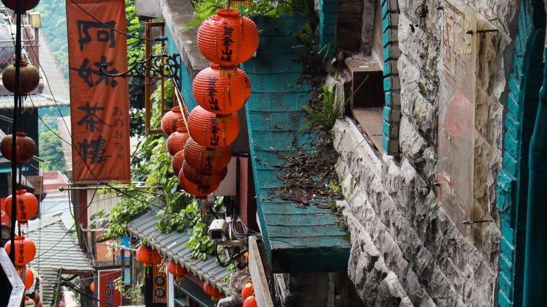alley way with hanging red lanterns