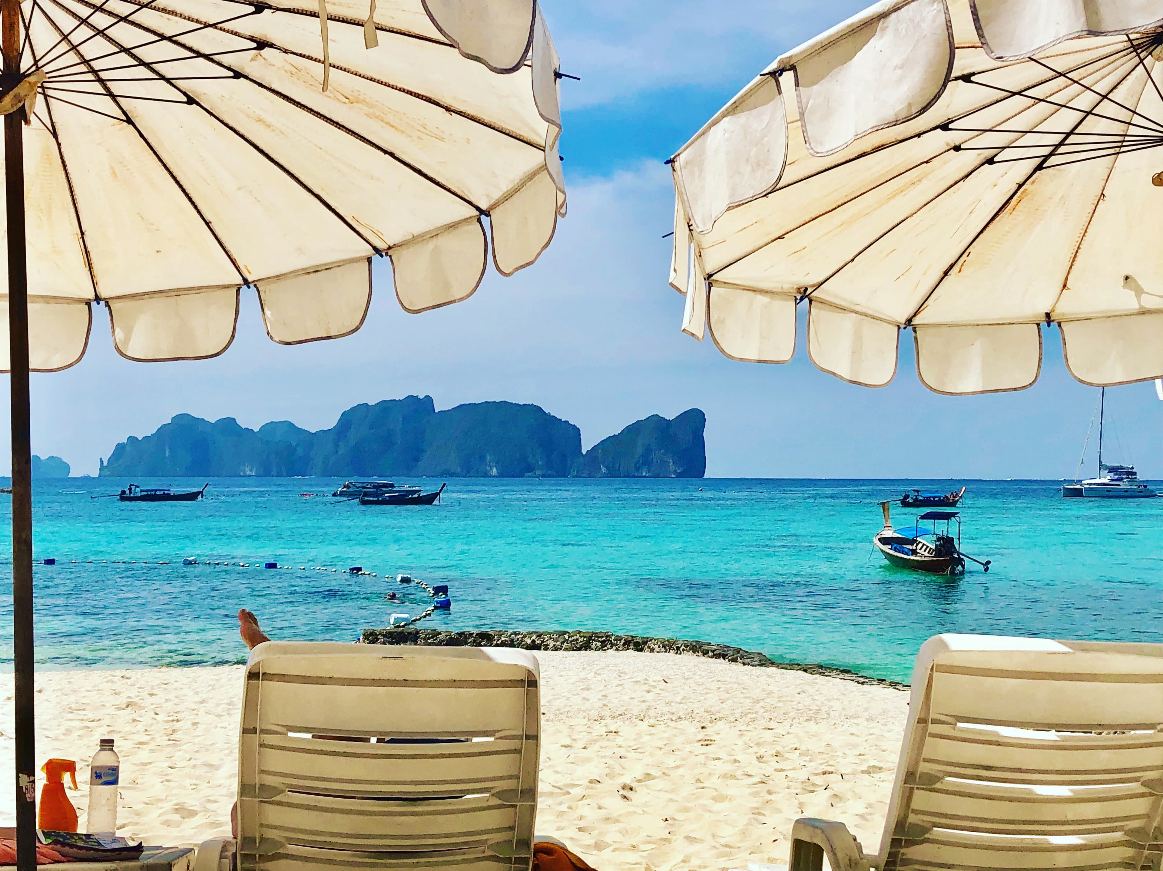 Picture of sunloungers and straw umbrellas at the beach