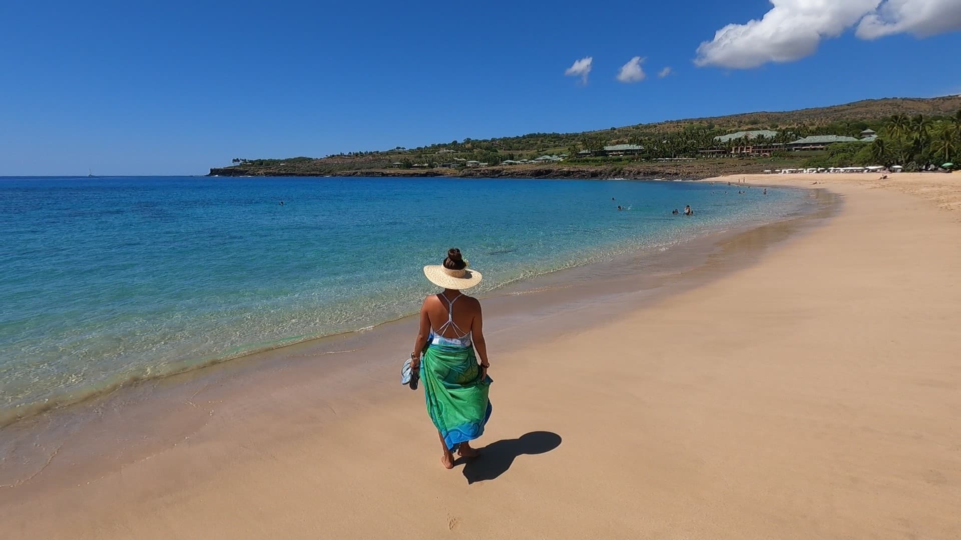 Travel advisor posing on a beach