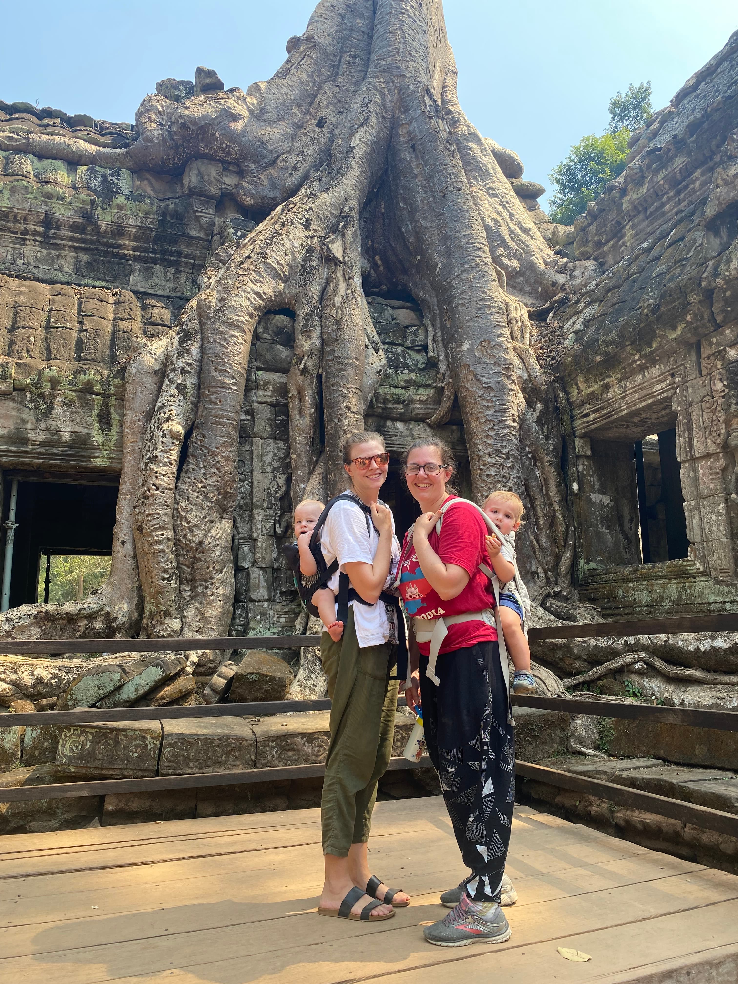 Women posing with kids