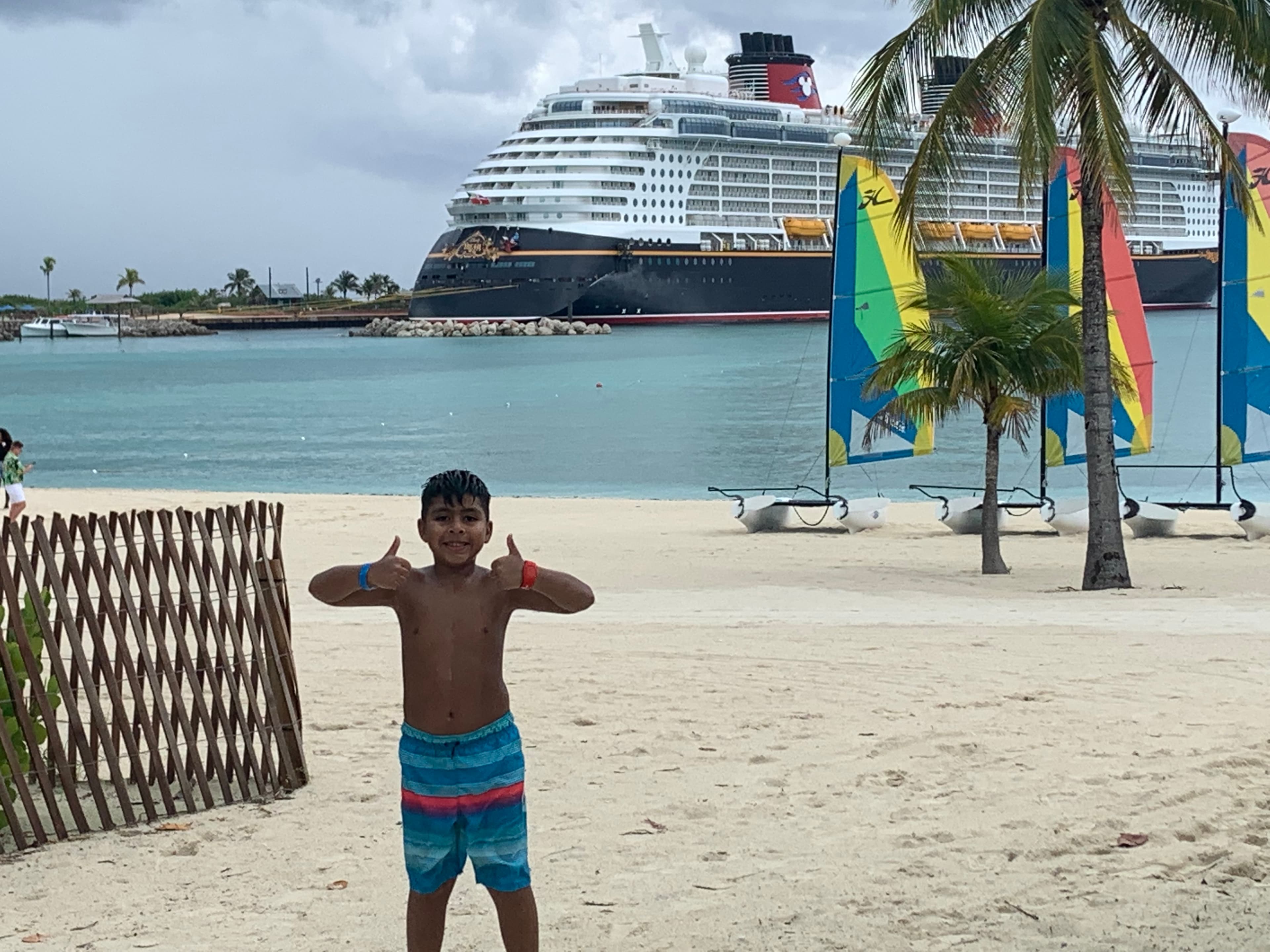 A kid posing on the beach