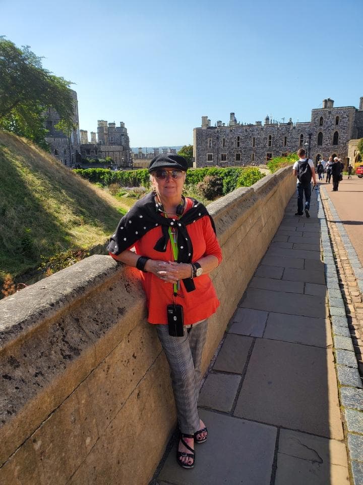 Travel advisor posing in front of an ancient place