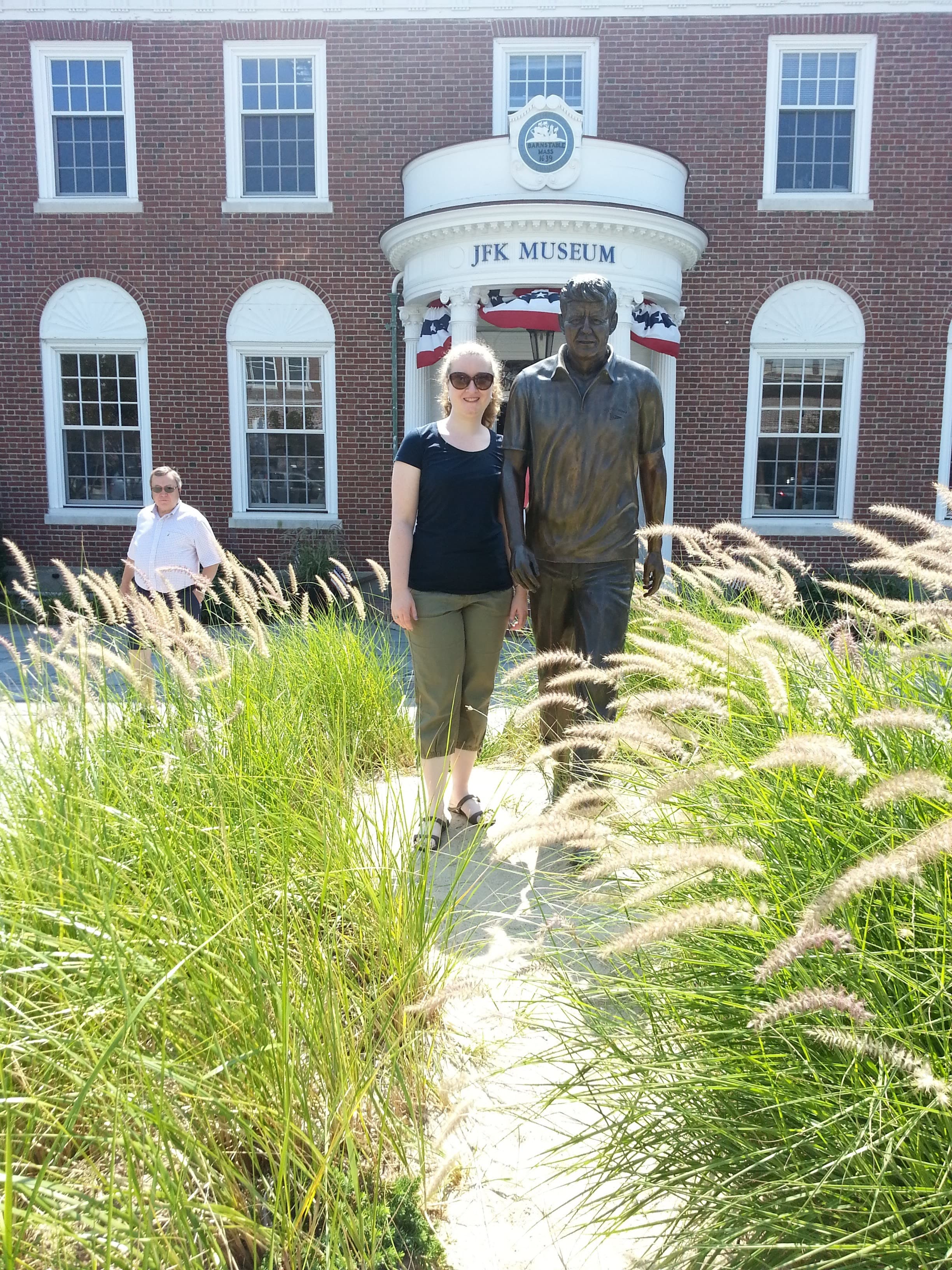 Posing for a picture with a statue